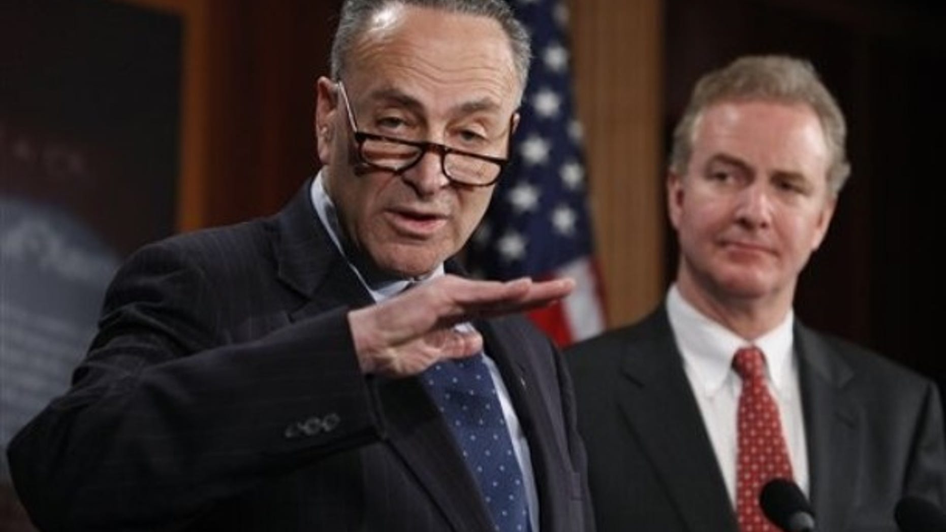 Sen. Charles Schumer, D-N.Y., left, accompanied by Rep. Chris Van Hollen, D-Md., gestures during a news conference introducing a bill to undo the Supreme Court's Citizens United ruling, Thursday, Feb. 11, 2010, on Capitol Hill in Washington. (AP Photo/Manuel Balce Ceneta)