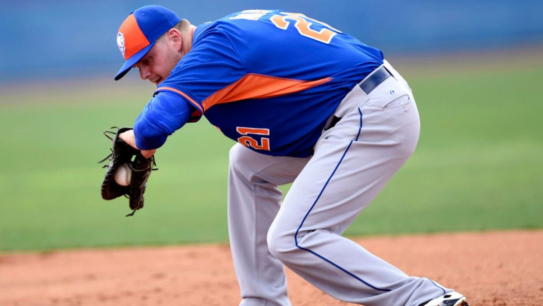 Feb 23, 2015; Port St. Lucie, FL, USA; New York Mets first baseman Lucas Duda (21) fields a ground ball during spring training at Tradition Field. Mandatory Credit: Brad Barr-USA TODAY Sports