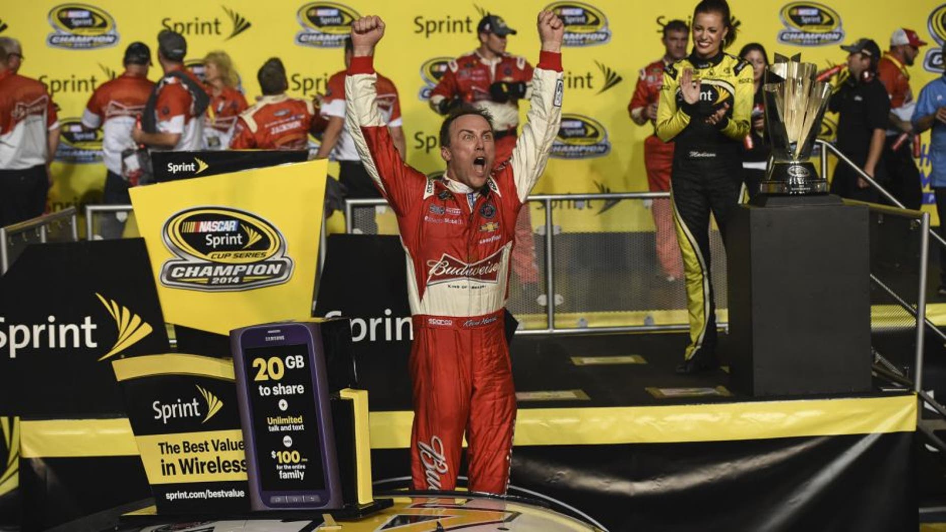 HOMESTEAD, FL - NOVEMBER 16: Kevin Harvick, driver of the #4 Budweiser Chevrolet, celebrates in victory lane after winning during the NASCAR Sprint Cup Series Ford EcoBoost 400 at Homestead-Miami Speedway on November 16, 2014 in Homestead, Florida.