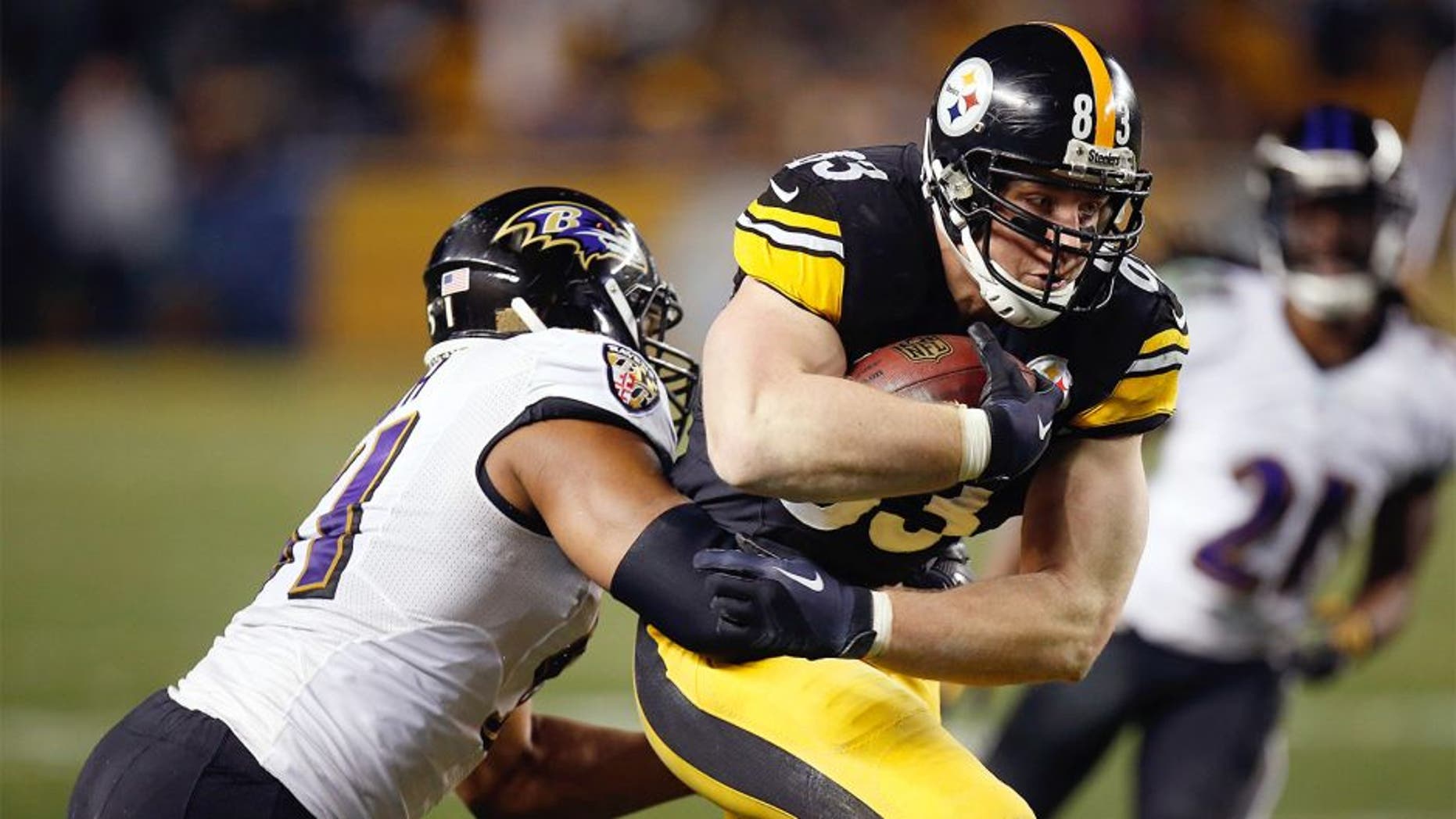 PITTSBURGH, PA - JANUARY 03: Heath Miller #83 of the Pittsburgh Steelers is tackled by Daryl Smith #51 of the Baltimore Ravens during their AFC Wild Card game at Heinz Field on January 3, 2015 in Pittsburgh, Pennsylvania. (Photo by Gregory Shamus/Getty Images)