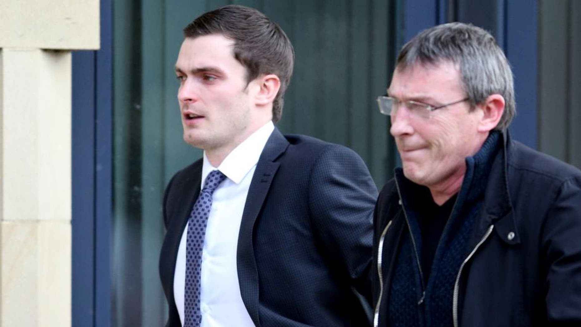 BRADFORD, ENGLAND - FEBRUARY 24: Footballer Adam Johnson (R) arrives with his father Dave at Bradford Crown Court for day nine of the trial where he is facing child sexual assault charges on February 24, 2016 in Bradford, England. The former Sunderland FC midfielder, 28, from Castle Eden, County Durham, has admitted one charge of sexual activity with a child and one charge of child grooming, but denies two further counts of sexual activity with a child. (Photo by Nigel Roddis/Getty Images)