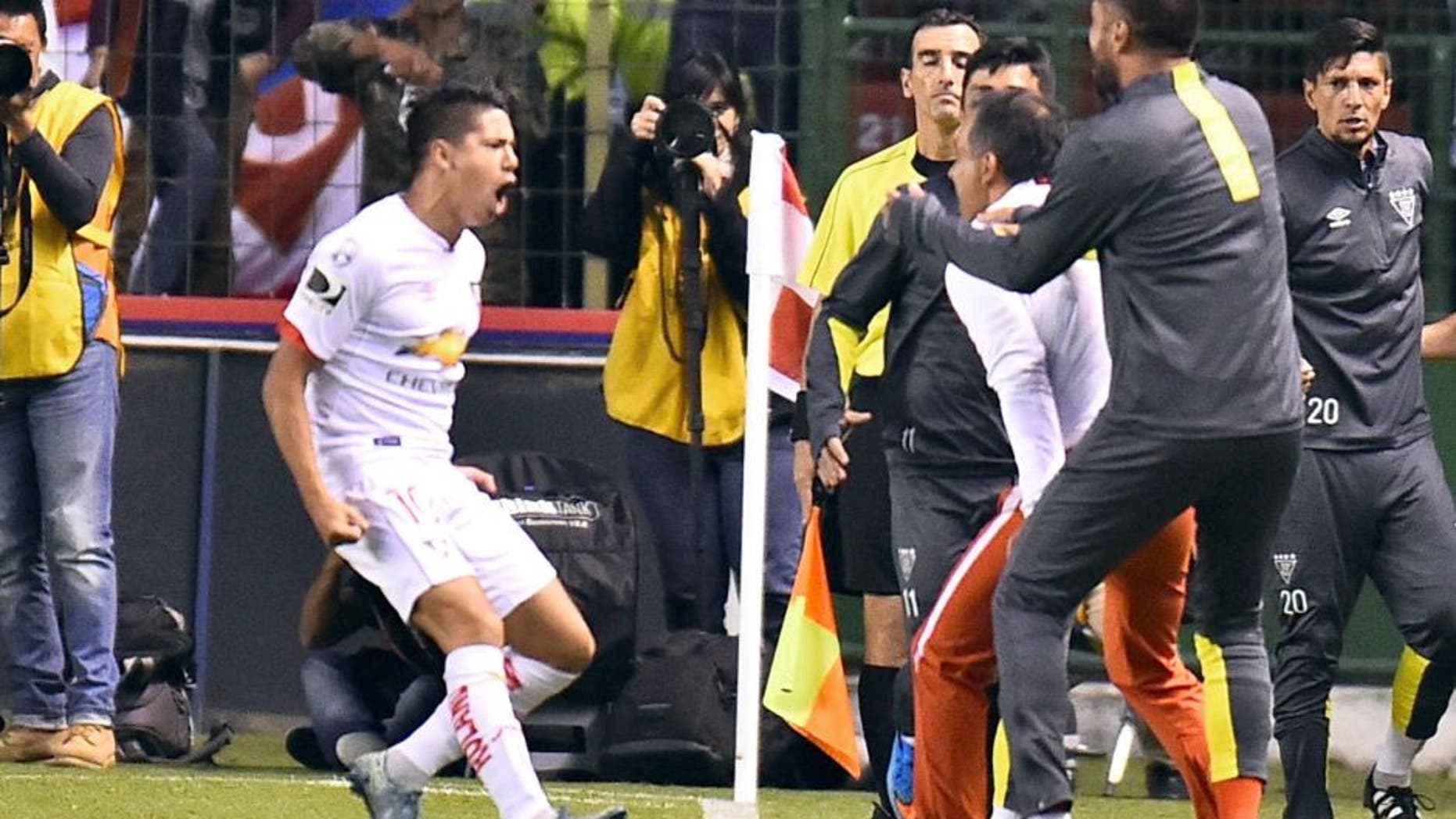 Ecuador's Liga de Quito Diego Morales (L) celebrates his goal against San Lorenzo during their Copa Libertadores football match at Casa Blanca stadium in Quito, on February 23, 2016. AFP PHOTO / RODRIGO BUENDIA / AFP / RODRIGO BUENDIA (Photo credit should read RODRIGO BUENDIA/AFP/Getty Images)