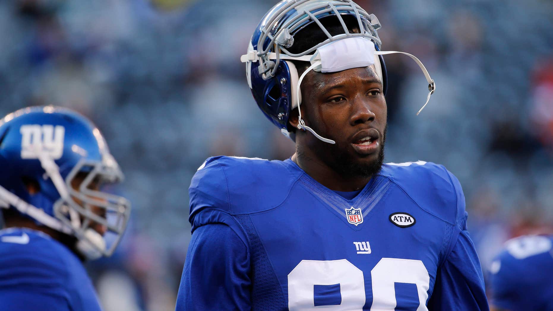 FILE - In this Jan. 3, 2016, file photo, New York Giants defensive end Jason Pierre-Paul (90) warms up before playing against the Philadelphia Eagles in an NFL football game in East Rutherford, N.J.
