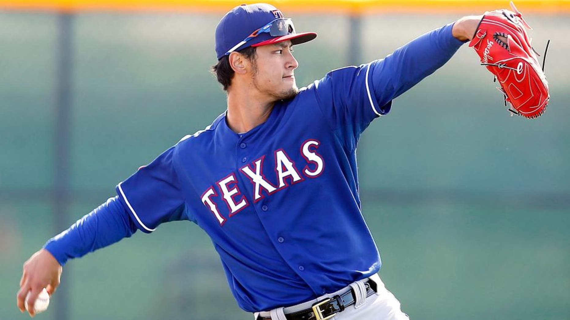 Feb 24, 2015; Surprise, AZ, USA; Texas Rangers starting pitcher Yu Darvish (11) warms up during spring training camp at Surprise Stadium. Mandatory Credit: Rick Scuteri-USA TODAY Sports