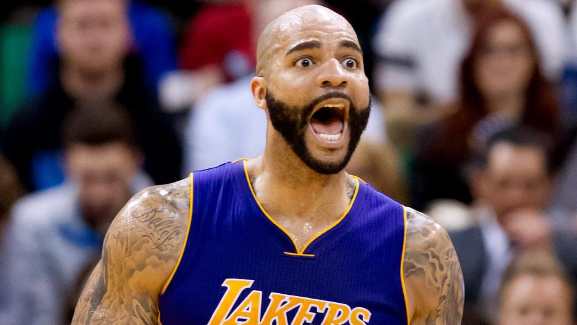 Feb 25, 2015; Salt Lake City, UT, USA; Los Angeles Lakers forward Carlos Boozer (5) reacts during the second half against the Utah Jazz at EnergySolutions Arena. The Lakers won 100-97. Mandatory Credit: Russ Isabella-USA TODAY Sports