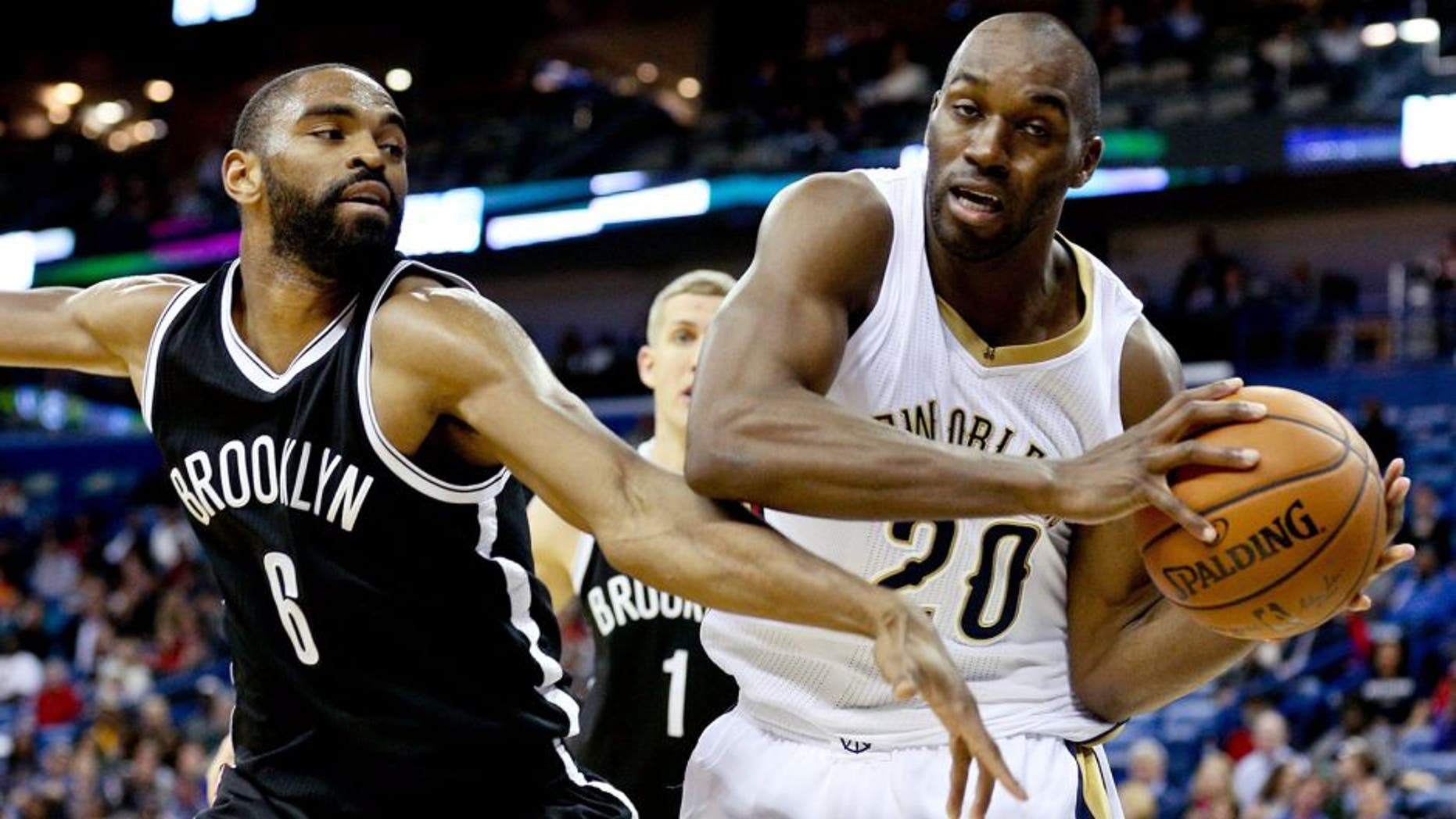 Feb 25, 2015; New Orleans, LA, USA; New Orleans Pelicans guard Quincy Pondexter (20) is defended by Brooklyn Nets guard Alan Anderson (6) during the fourth quarter of a game at the Smoothie King Center. The Pelicans defeated the Nets 102-96. Mandatory Credit: Derick E. Hingle-USA TODAY Sports