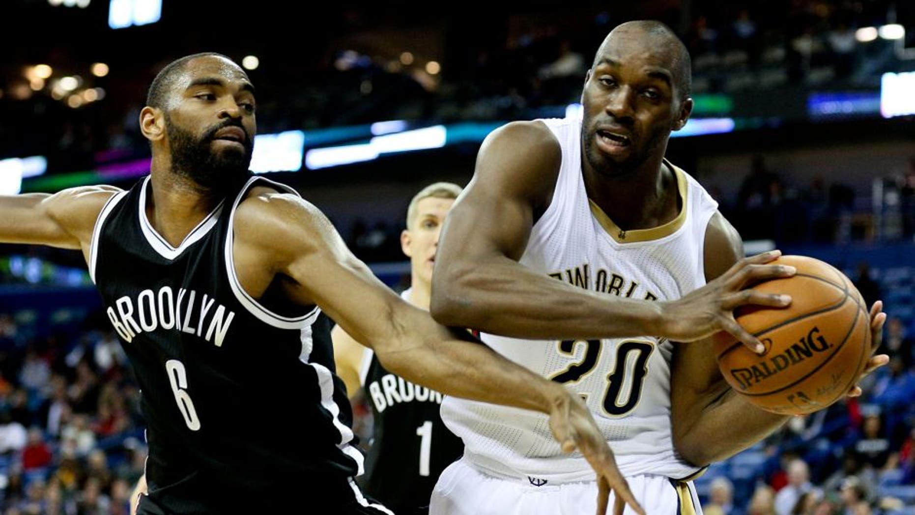 Feb 25, 2015; New Orleans, LA, USA; New Orleans Pelicans guard Quincy Pondexter (20) is defended by Brooklyn Nets guard Alan Anderson (6) during the fourth quarter of a game at the Smoothie King Center. The Pelicans defeated the Nets 102-96. Mandatory Credit: Derick E. Hingle-USA TODAY Sports