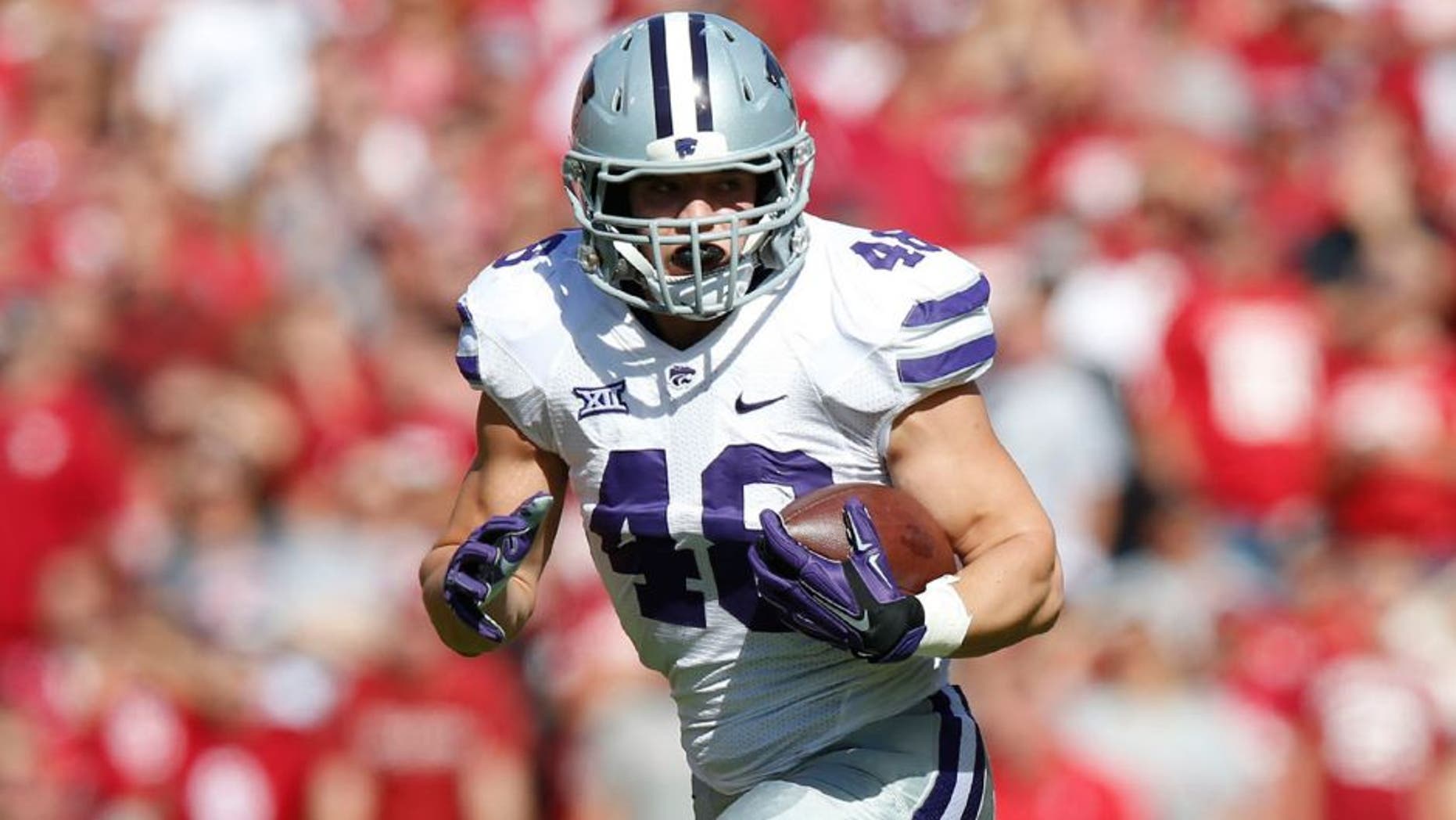 Kansas State fullback Glenn Gronkowski (48) runs with a touchdown reception covering 62 yards in the first quarter against Oklahoma at Memorial Stadium in Norman, Okla., on Saturday, Oct. 18, 2014. K-State won, 31-30. (Bo Rader/Wichita Eagle/MCT)