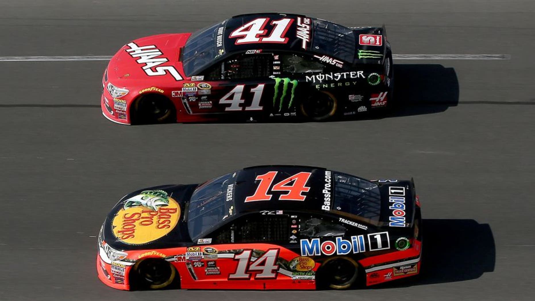 DAYTONA BEACH, FL - FEBRUARY 21: Brian Vickers, driver of the #14 Bass Pro Shops/Mobil 1 Chevrolet, races Kurt Busch, driver of the #41 Haas Automation/Monster Energy Chevrolet, during the NASCAR Sprint Cup Series DAYTONA 500 at Daytona International Speedway on February 21, 2016 in Daytona Beach, Florida. (Photo by Sean Gardner/Getty Images)