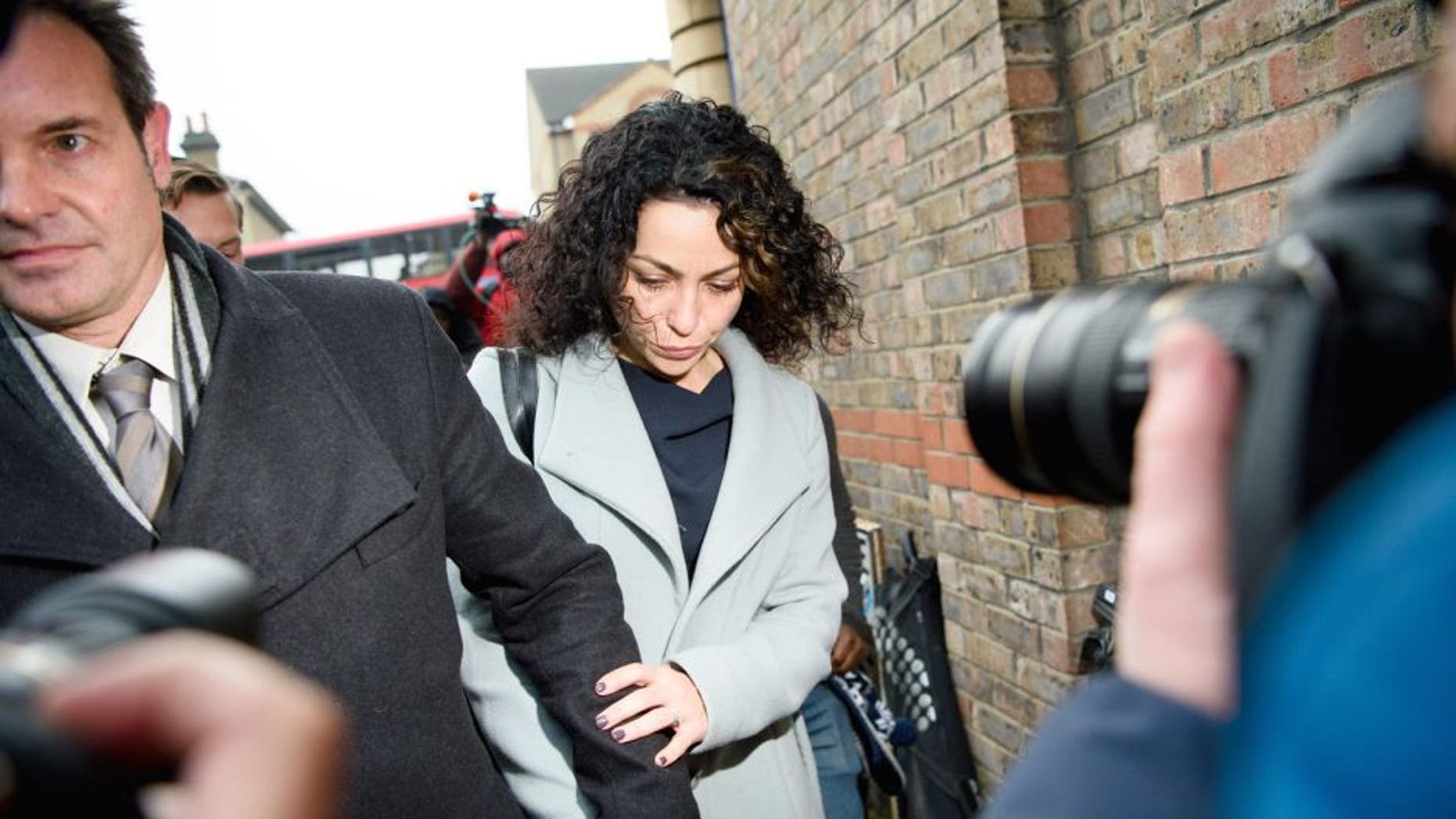 Former Chelsea first-team doctor Eva Carneiro (C) accompanied by her husband Jason De Carteret (L) leaves Croydon employment tribunal in London on January 6, 2016. Carneiro attended the tribunal hearing today regarding her constructive dismissal case against the club. The preliminary hearing at London South Employment Tribunal is being held in private before an employment judge and will outline the timetable for the case. AFP PHOTO / LEON NEAL / AFP / LEON NEAL (Photo credit should read LEON NEAL/AFP/Getty Images)