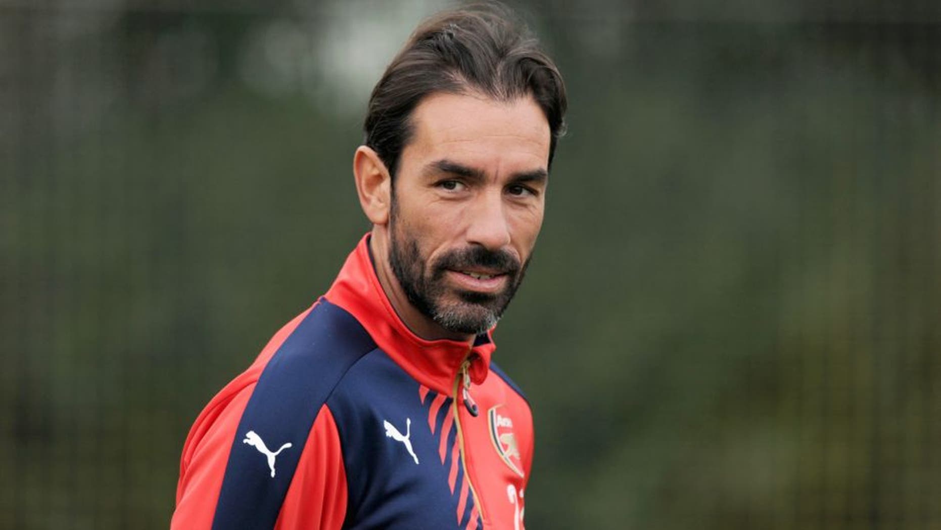 ST ALBANS, ENGLAND - OCTOBER 23: ex Arsenal player Robert Pires watches a training session at London Colney on October 23, 2015 in St Albans, England. (Photo by Stuart MacFarlane/Arsenal FC via Getty Images)
