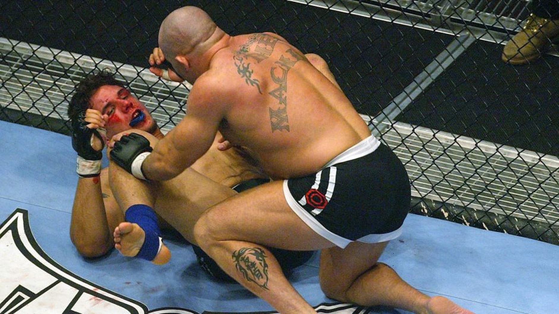 LONDON - JULY 13: Ian Freeman of Great Britain fights with Frank Mir of the USA during the Ultimate Fighting Championship, "Brawl in the Royal Albert Hall", in the Royal Albert Hall London, England on July 13, 2002. (Photo by Mike Hewitt/Getty Images)
