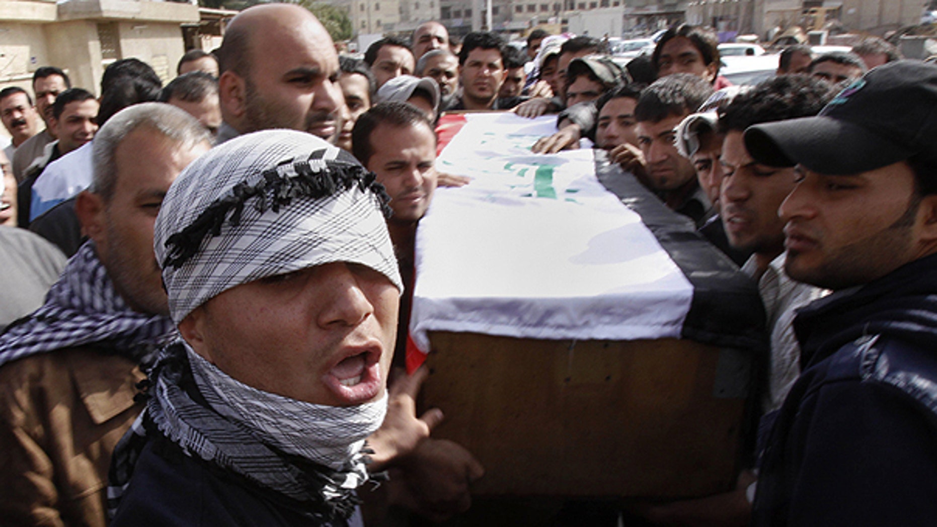 Feb. 26: Relatives of Salim Farooq, 18, carry his coffin during his funeral procession in Basra, Iraq's second-largest city, Iraq. Farooq was killed on Friday during a demonstration in Basra, his family said.