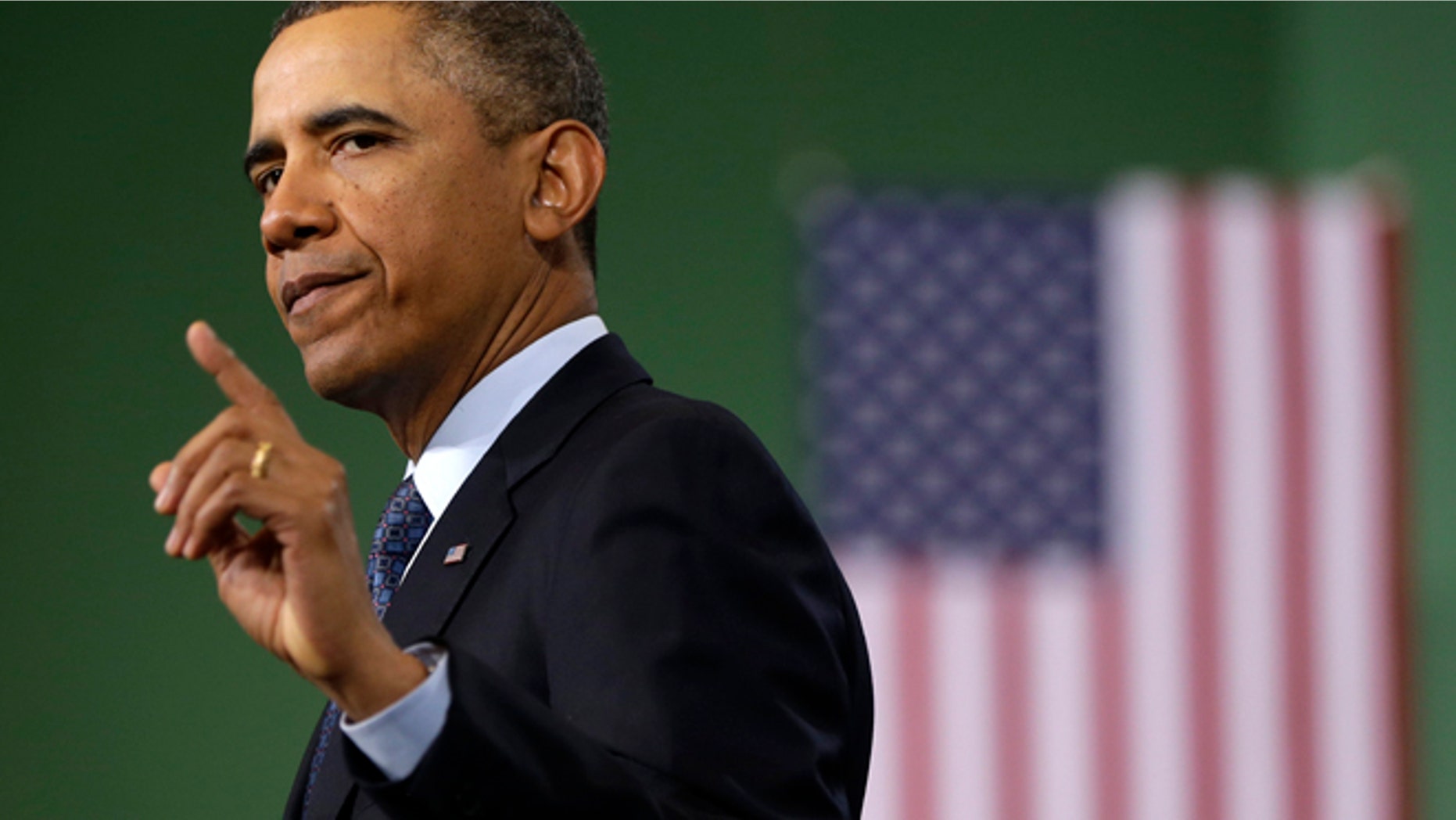President Barack Obama gestures as he speaks about automatic defense budget cuts during a visit to Newport News Shipbuilding, a division of Huntington Ingalls Industries, Tuesday, Feb. 26, 2103, in Newport News, Va. (AP Photo/Charles Dharapak)