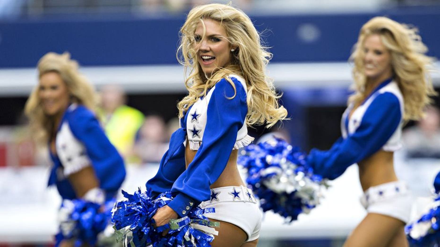 ARLINGTON, TX - NOVEMBER 02: Cheerleaders of the Dallas Cowboys perform before a game against the Arizona Cardinals at AT&T Stadium on November 2, 2014 in Arlington, Texas. The Cardinals defeated the Cowboys 28-17. (Photo by Wesley Hitt/Getty Images)