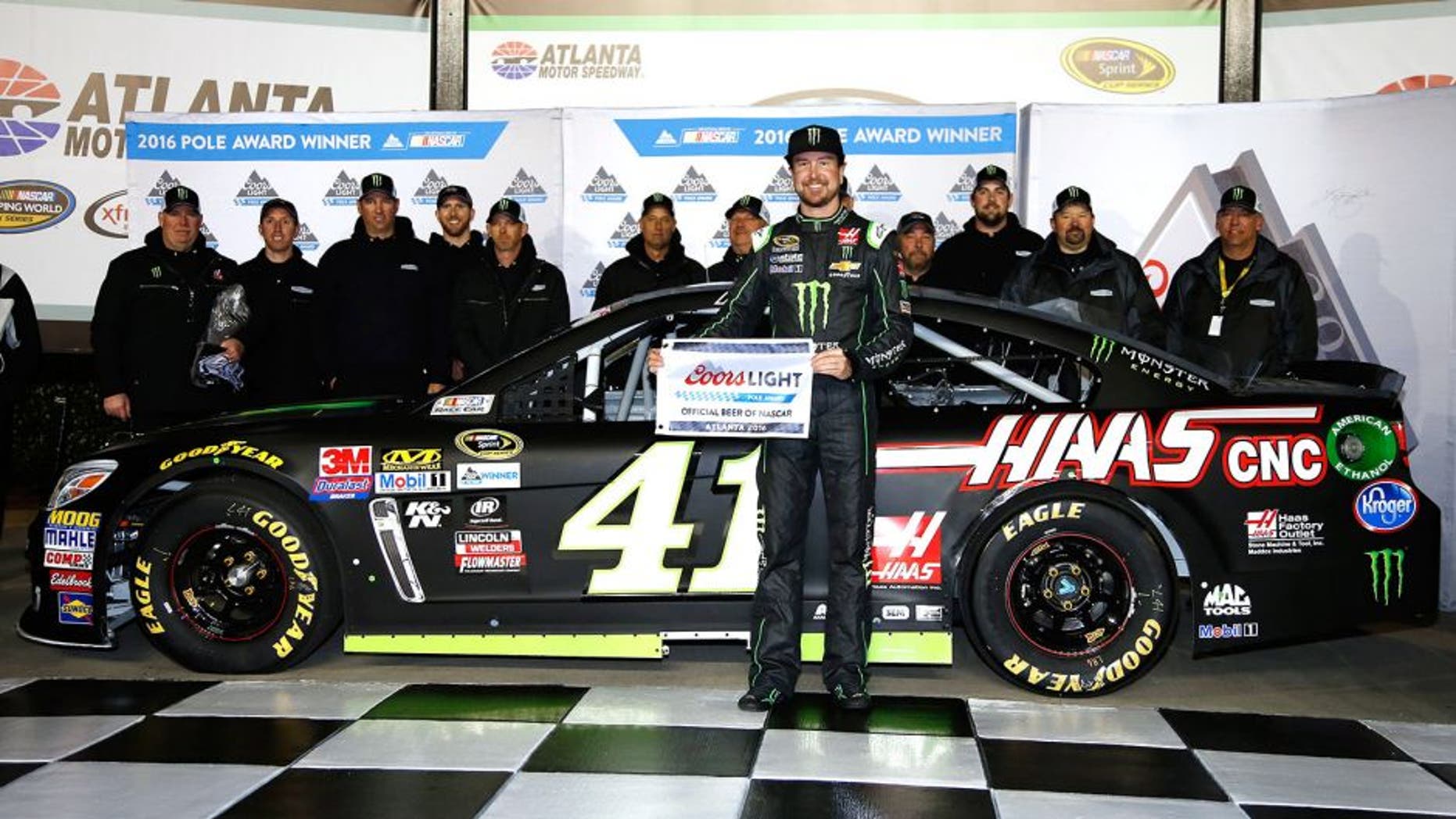 HAMPTON, GA - FEBRUARY 26: Kurt Busch, driver of the #41 Monster Energy/Haas Automation Chevrolet, poses with the Coors Light Pole Award after qualifying for pole position for the NASCAR Sprint Cup Series Folds of Honor QuikTrip 500 at Atlanta Motor Speedway on February 26, 2016 in Hampton, Georgia. (Photo by Todd Warshaw/NASCAR via Getty Images)