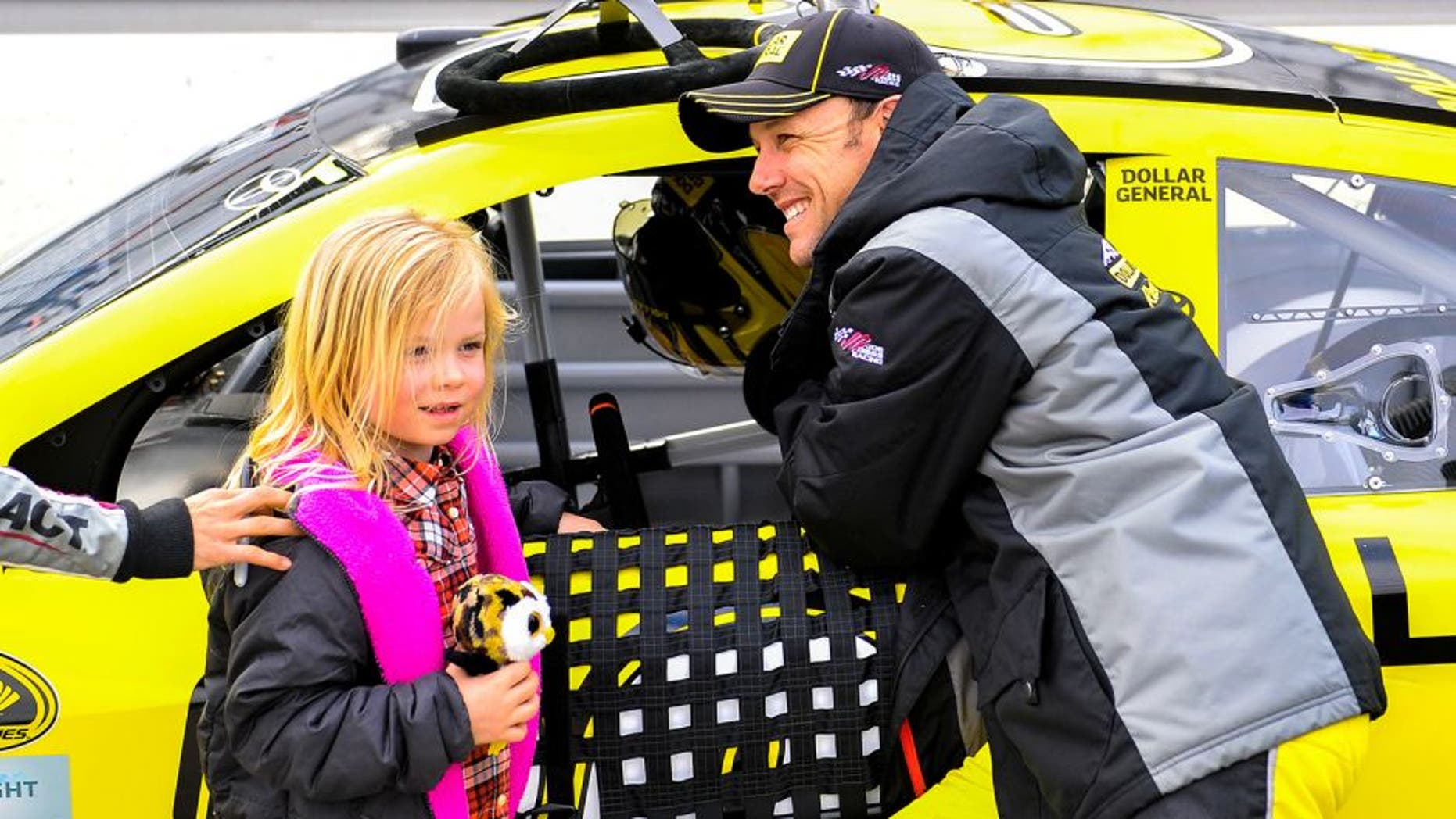 MARTINSVILLE, VA - MARCH 27: Matt Kenseth, driver of the #20 Dollar General Toyota, stands on the grid with his daughter, Grace, prior to qualifying the NASCAR Sprint Cup Series STP 500 at Martinsville Speedway on March 27, 2015 in Martinsville, Virginia. (Photo by Alex Goodlett/Getty Images)
