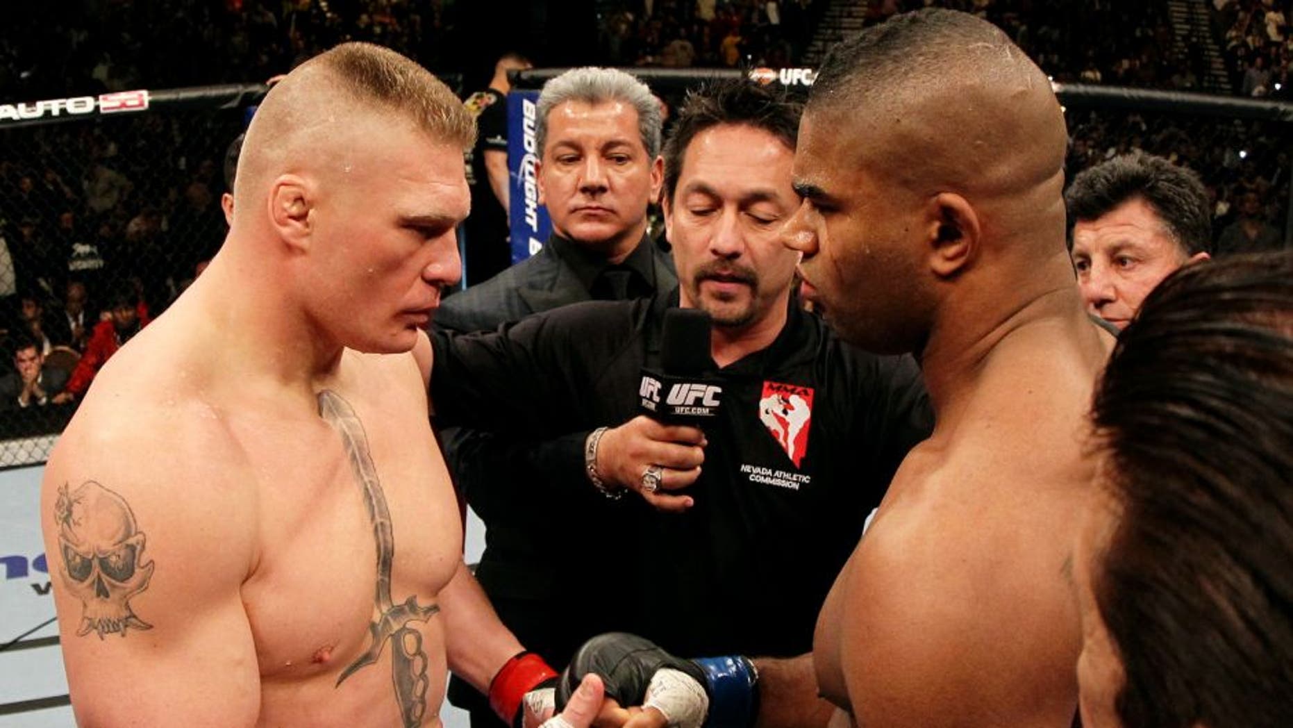 LAS VEGAS, NV - DECEMBER 30: (L-R) Heavyweight opponents Brock Lesnar and Alistair Overeem receive final instructions from the referee before their main event bout during the UFC 141 event at the MGM Grand Garden Arena on December 30, 2011 in Las Vegas, Nevada. (Photo by Josh Hedges/Zuffa LLC/Zuffa LLC via Getty Images)