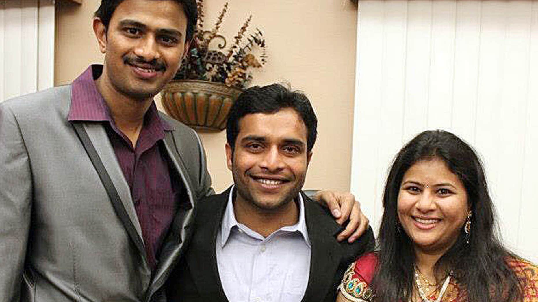 In this undated photo provided by Kranti Shalia, Srinivas Kuchibhotla, left, poses for photo with Alok Madasani and his wife Sunayana Dumala in Cedar Rapids, Iowa.