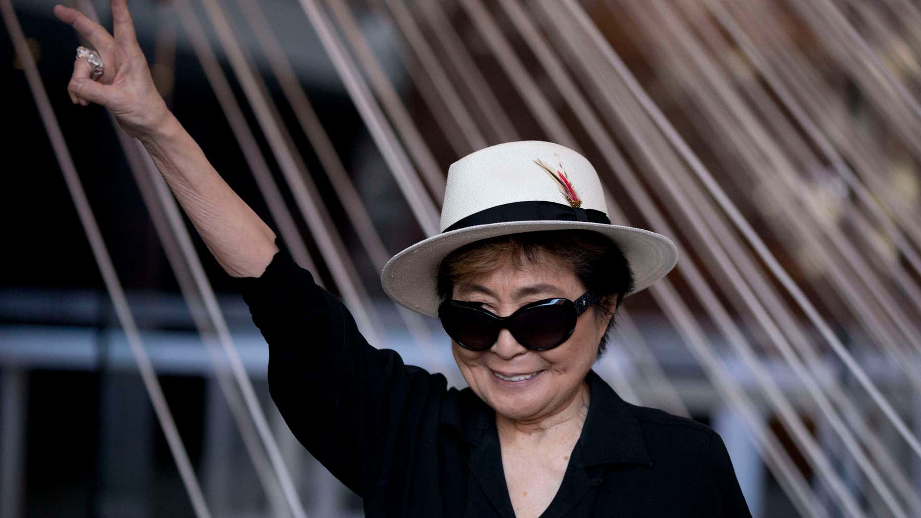 Feb. 2, 2016: Yoko Ono poses for photographers in front of a work entitled "Morning Beams/River Bed," at a press event to mark the opening of her exhibiition "Land of Hope" at the Museum of Memory and Tolerance in Mexico City.