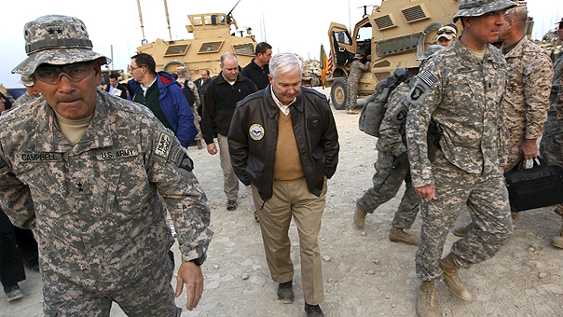 In this Dec. 7, 2010 file photo, Defense Secretary Robert Gates walks with Maj. Gen. John Campbell, left,, commanding general of the 101st Air Assault, in Kunar Province, Afghanistan.