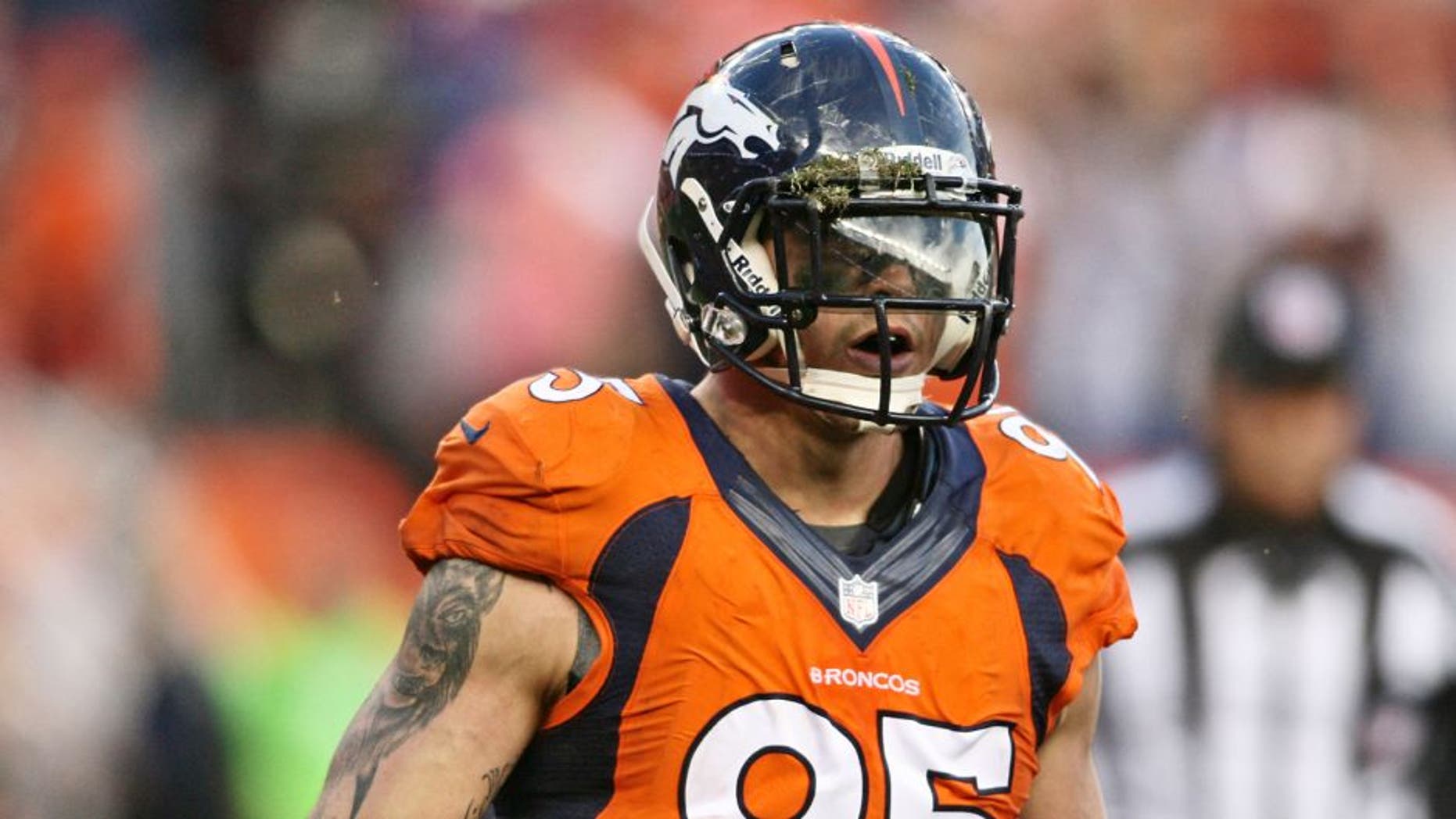 Oct 27, 2013; Denver, CO, USA; Denver Broncos defensive end Derek Wolfe (95) after recovering a fumble during the game against the Washington Redskins at Sports Authority Field at Mile High. Mandatory Credit: Chris Humphreys-USA TODAY Sports