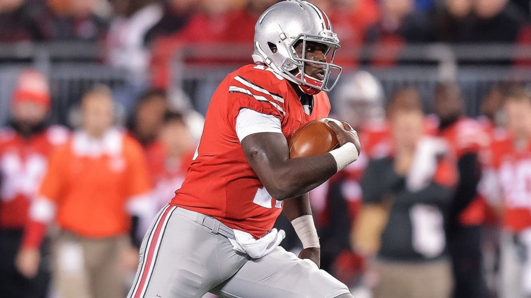 COLUMBUS, OH - NOVEMBER 7: Quarterback Cardale Jones #12 of the Ohio State Buckeyes runs with the ball against the Minnesota Golden Gophers at Ohio Stadium on November 7, 2015 in Columbus, Ohio. (Photo by Jamie Sabau/Getty Images)