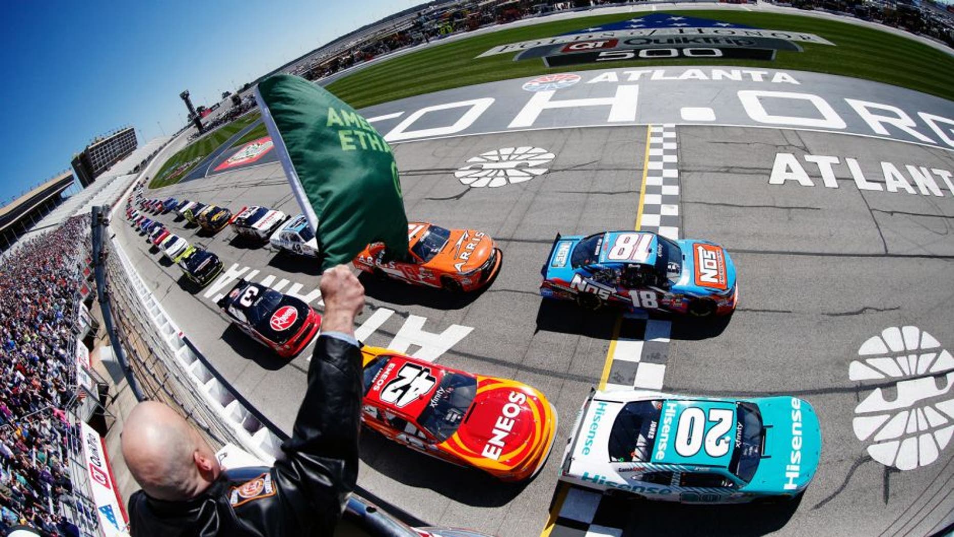 HAMPTON, GA - FEBRUARY 27: Kyle Busch, driver of the #18 NOS Energy Drink Toyota, and Erik Jones, driver of the #20 Hisense USA Toyota, lead the field past the green flag to start the NASCAR XFINITY Series Heads Up Georgia 250 at Atlanta Motor Speedway on February 27, 2016 in Hampton, Georgia. (Photo by Matt Sullivan/NASCAR via Getty Images)