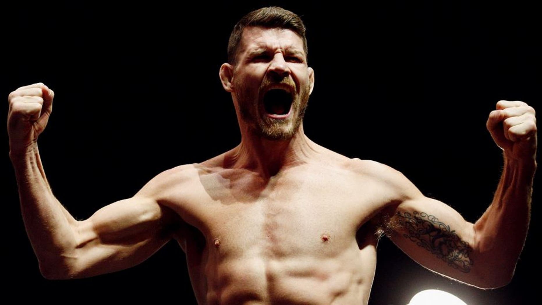 LONDON, ENGLAND - FEBRUARY 26: Michael 'The Count' Bisping of England screams on stage during the UFC Fight Night Weigh-in held at at Indigo at The O2 Arena on February 26, 2016 in London, England. Anderson 'The Spider' Silva of Brazil and Michael 'The Count' Bisping of England will fight tomorrow night in the O2 Arena. (Photo by Dean Mouhtaropoulos/Zuffa LLC/Zuffa LLC via Getty Images)