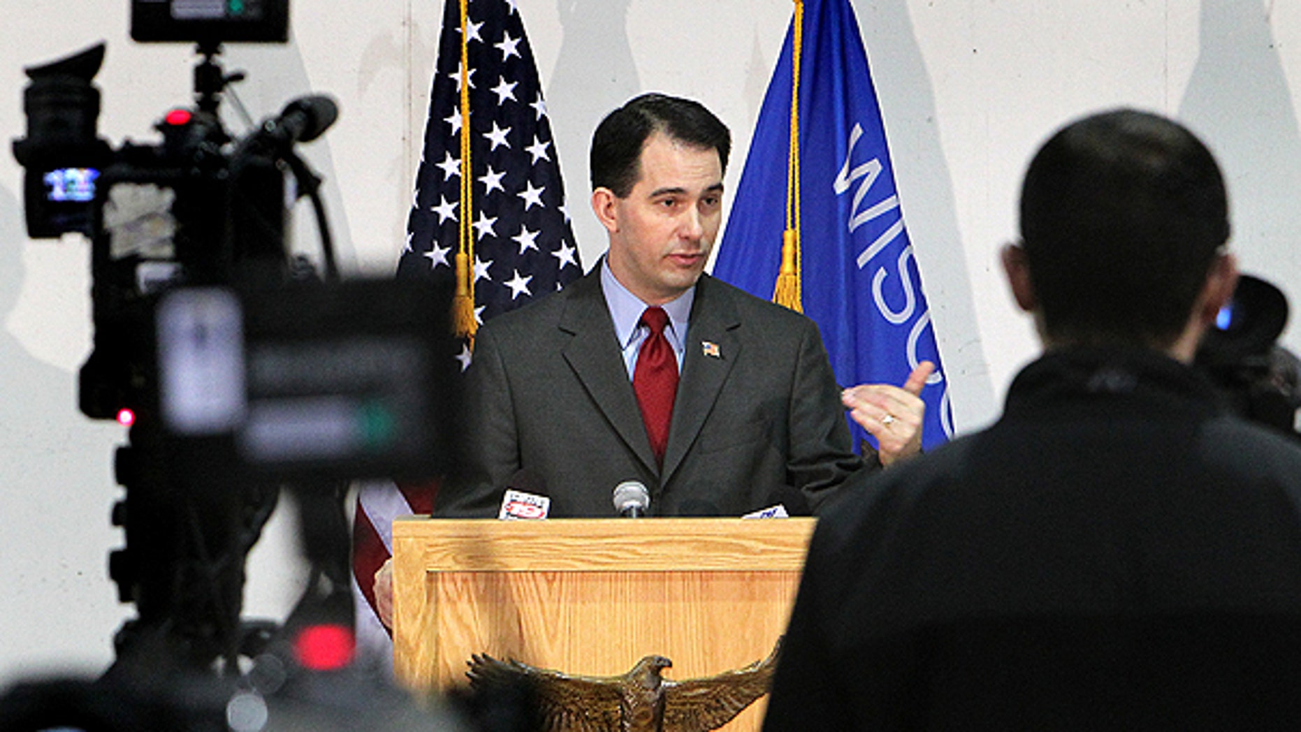 Feb. 28: Gov. Scott Walker addresses the media during a news conference at Colgan Air Services at the La Crosse Municipal Airport in La Crosse, Wis.