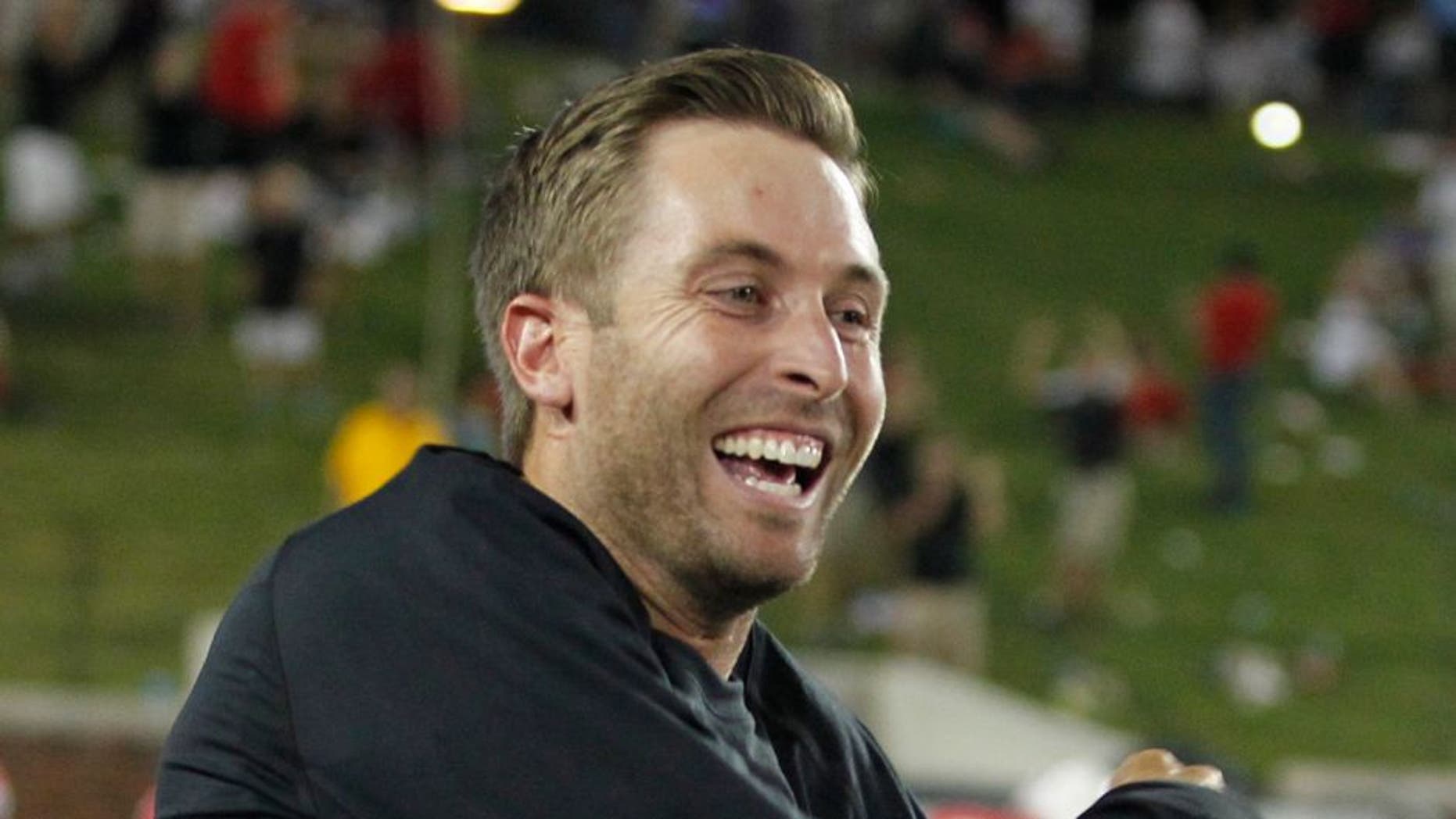 Aug 30, 2013; Dallas, TX, USA; Texas Tech Red Raiders head coach Kliff Kingsbury celebrates a touchdown in the fourth quarter of the game against the Southern Methodist Mustangs at Gerald J. Ford Stadium. Texas Tech won 41-23. Mandatory Credit: Tim Heitman-USA TODAY Sports