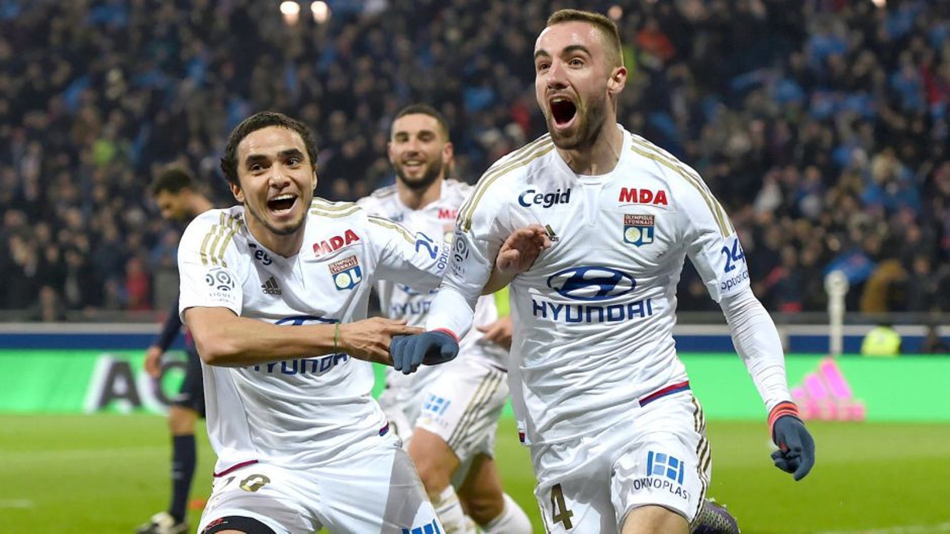 Lyon's Spanish midfielder Sergi Darder (R) reacts after scoring next to Lyon's Brazilian defender Rafael Pereira Da Silva (L) during the French Ligue1 football match between Olympique Lyonnais and Paris Saint-Germain, on February 28, 2016 at the New stadium in Decines-Charpieu near Lyon, southeastern France. AFP PHOTO/PHILIPPE DESMAZES / AFP / PHILIPPE DESMAZES (Photo credit should read PHILIPPE DESMAZES/AFP/Getty Images)