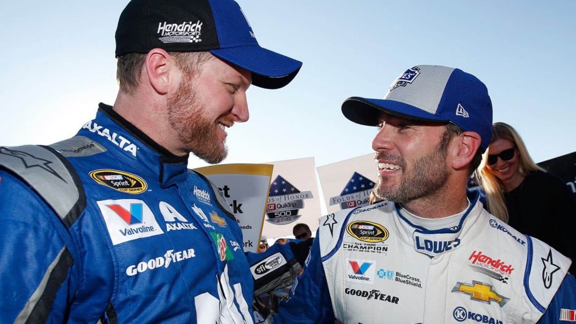 HAMPTON, GA - FEBRUARY 28: Jimmie Johnson, driver of the #48 Lowe's Chevrolet, celebrates with Dale Earnhardt Jr, driver of the #88 Nationwide Chevrolet, in Victory Lane after winning the NASCAR Sprint Cup Series Folds of Honor QuikTrip 500 at Atlanta Motor Speedway on February 28, 2016 in Hampton, Georgia. (Photo by Todd Warshaw/NASCAR via Getty Images)