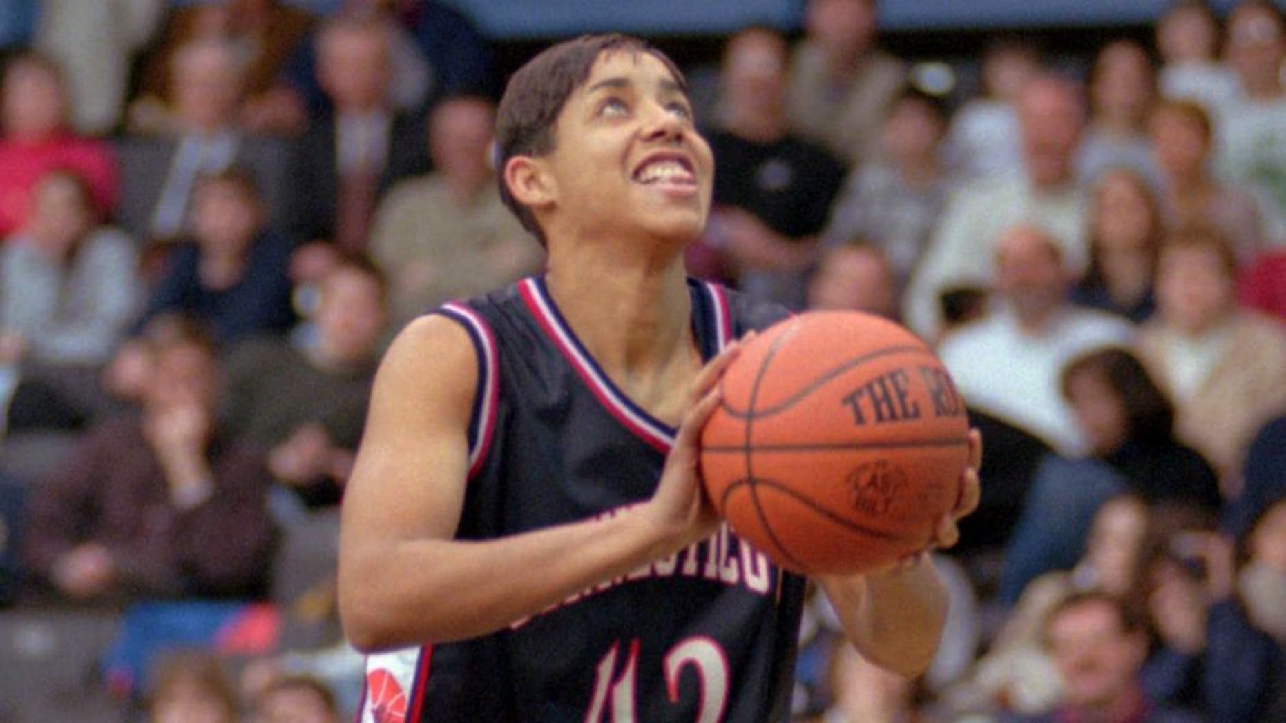 Connecticut's Nykesha Sales shoots an uncontested lay-up to break the school's all-time scoring record against Villanova Tuesday, Feb. 24, 1998 in Villanova, Pa. Sales, who is out for the remainder of the season with a ruptured Achilles tendon, made the two points in a pre-arranged deal with Villanova. After scoring the points needed she left the court and Villanova made an uncontested shot to even the score at 2-2. (AP Photo/Chris Gardner)