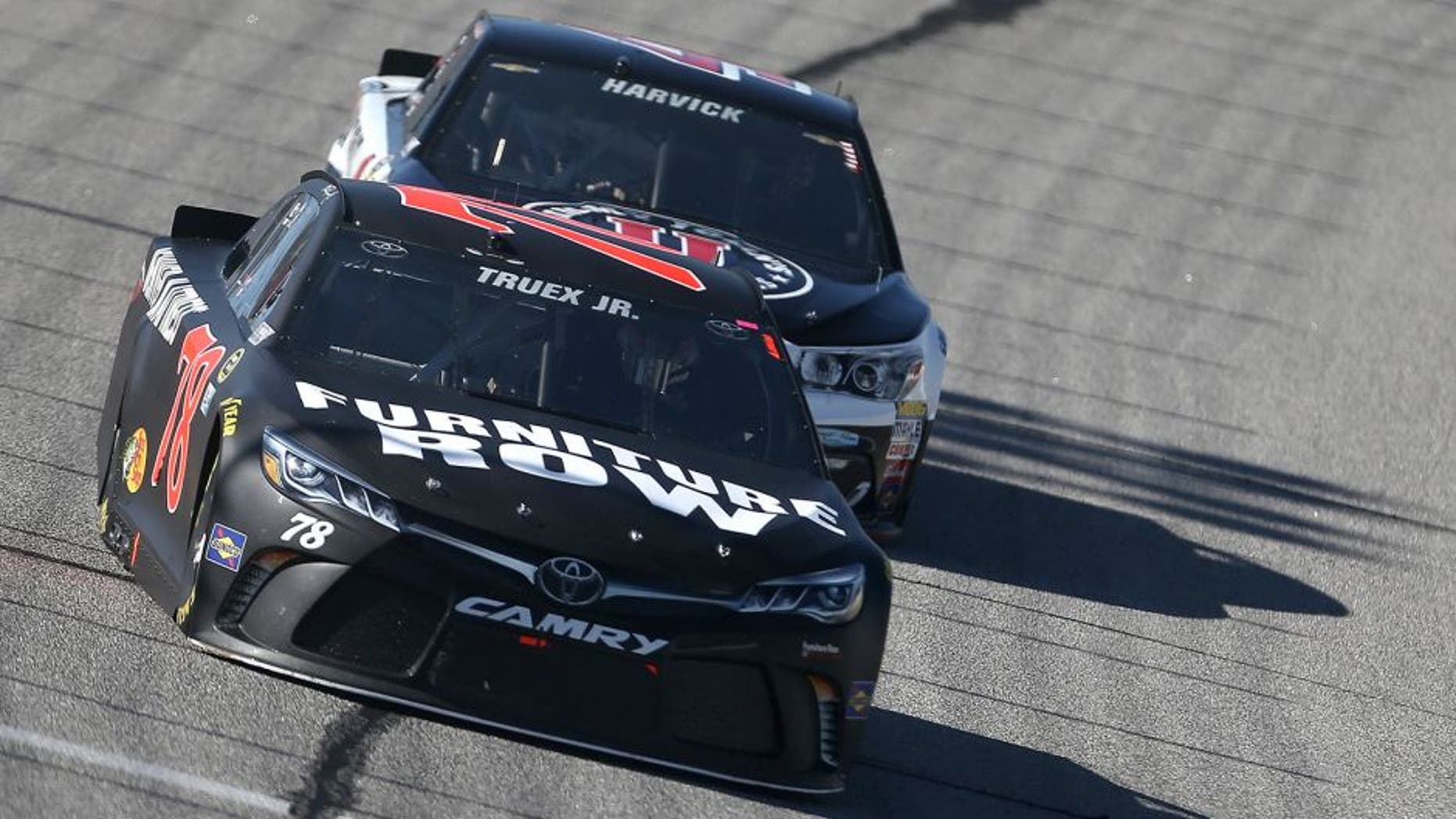 HAMPTON, GA - FEBRUARY 28: Martin Truex Jr, driver of the #78 Furniture Row Toyota, leads Kevin Harvick, driver of the #4 Jimmy John's Chevrolet, during the NASCAR Sprint Cup Series Folds of Honor QuikTrip 500 at Atlanta Motor Speedway on February 28, 2016 in Hampton, Georgia. (Photo by Matt Hazlett/Getty Images)