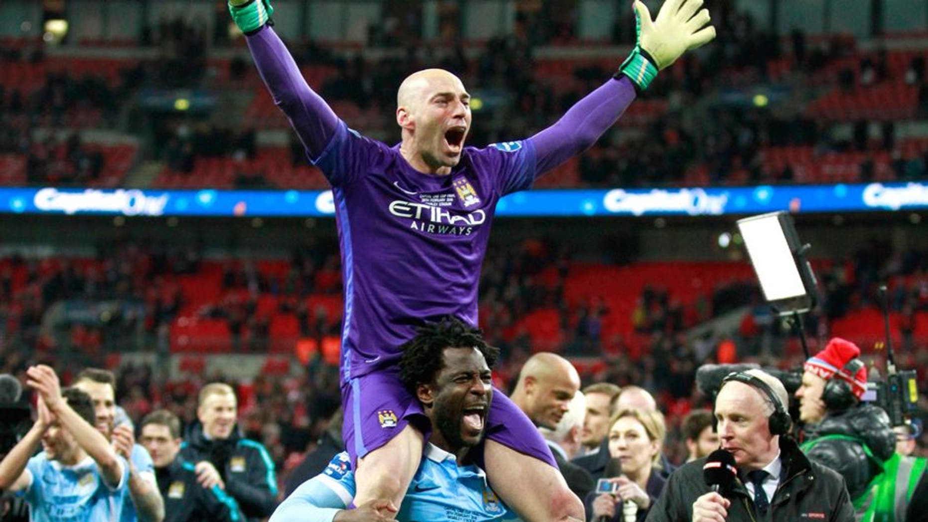 Football Soccer - Liverpool v Manchester City - Capital One Cup Final - Wembley Stadium - 28/2/16 Manchester City's Wilfredo Caballero and Wilfried Bony celebrate after the game Action Images via Reuters / Paul Childs Livepic EDITORIAL USE ONLY. No use with unauthorized audio, video, data, fixture lists, club/league logos or "live" services. Online in-match use limited to 45 images, no video emulation. No use in betting, games or single club/league/player publications. Please contact your account representative for further details.