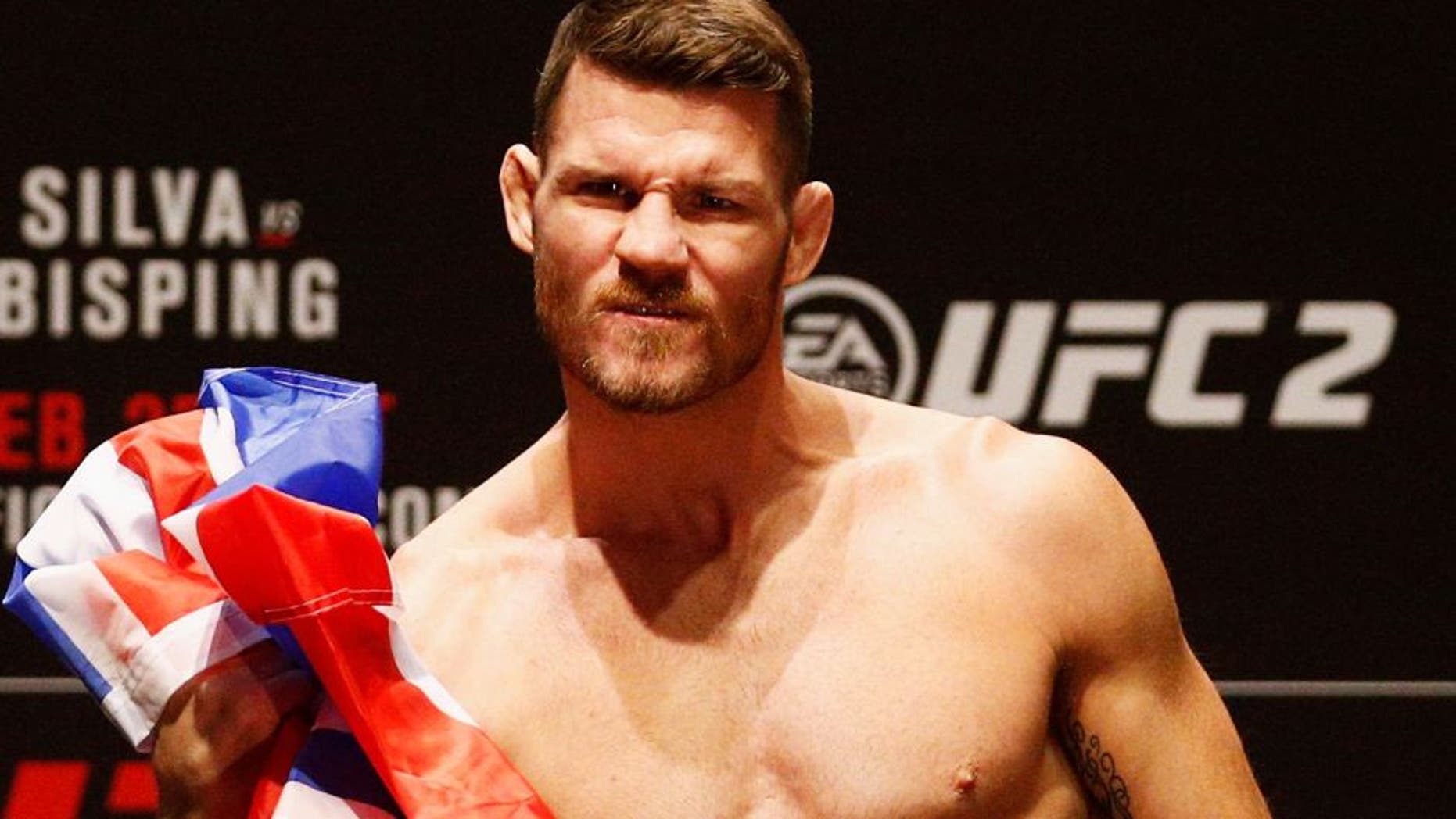 LONDON, ENGLAND - FEBRUARY 26: Michael 'The Count' Bisping of England celebrates on the scales on stage during the UFC Fight Night Weigh-in held at at Indigo at The O2 Arena on February 26, 2016 in London, England. Anderson 'The Spider' Silva of Brazil and Michael 'The Count' Bisping of England will fight tomorrow night in the O2 Arena. (Photo by Dean Mouhtaropoulos/Zuffa LLC/Zuffa LLC via Getty Images)