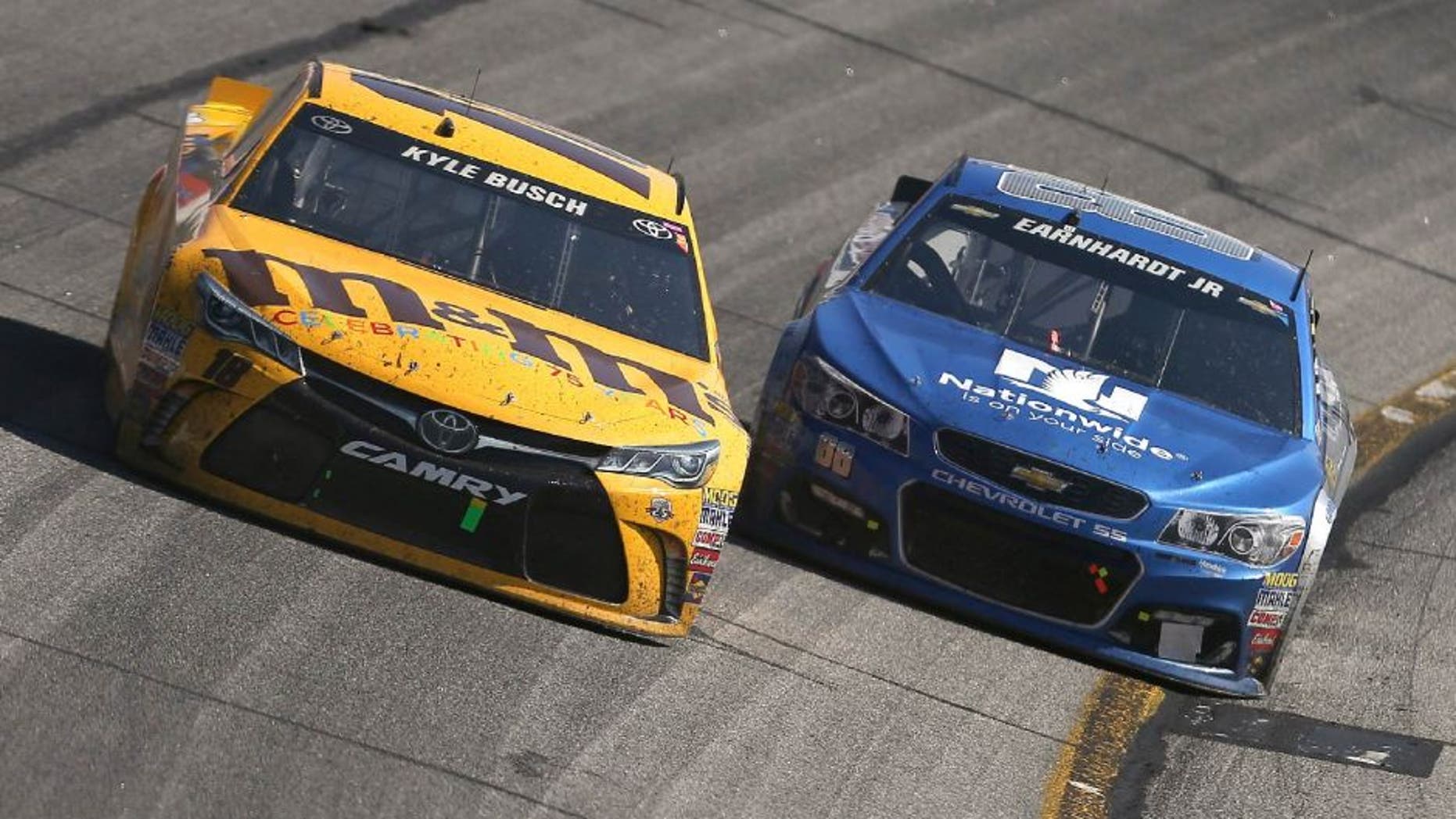 HAMPTON, GA - FEBRUARY 28: Kyle Busch, driver of the #18 M&M's 75 Toyota, races Dale Earnhardt Jr, driver of the #88 Nationwide Chevrolet, during the NASCAR Sprint Cup Series Folds of Honor QuikTrip 500 at Atlanta Motor Speedway on February 28, 2016 in Hampton, Georgia. (Photo by Matt Hazlett/Getty Images)