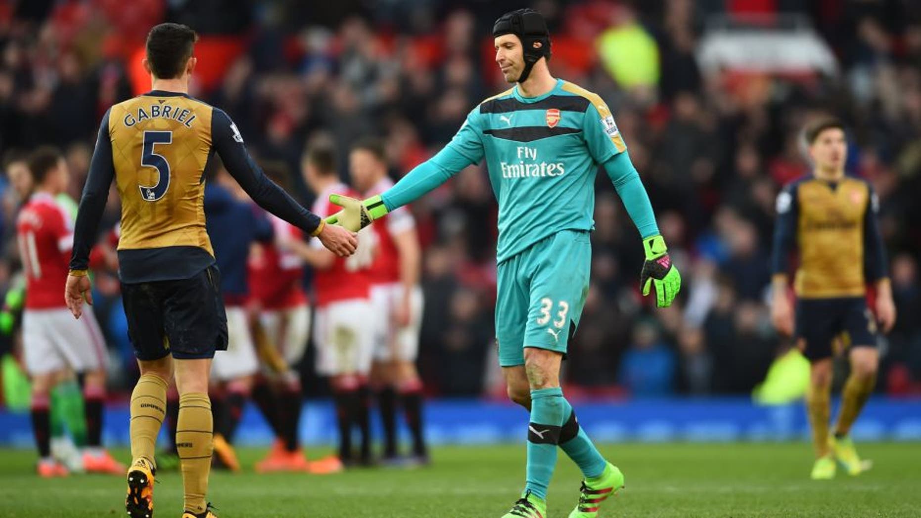 MANCHESTER, ENGLAND - FEBRUARY 28: Petr Cech of Arsenal shakes hands with Gabriel Paulista of Arsenal after the Barclays Premier League match between Manchester United and Arsenal at Old Trafford on February 28, 2016 in Manchester, England. (Photo by Laurence Griffiths/Getty Images)