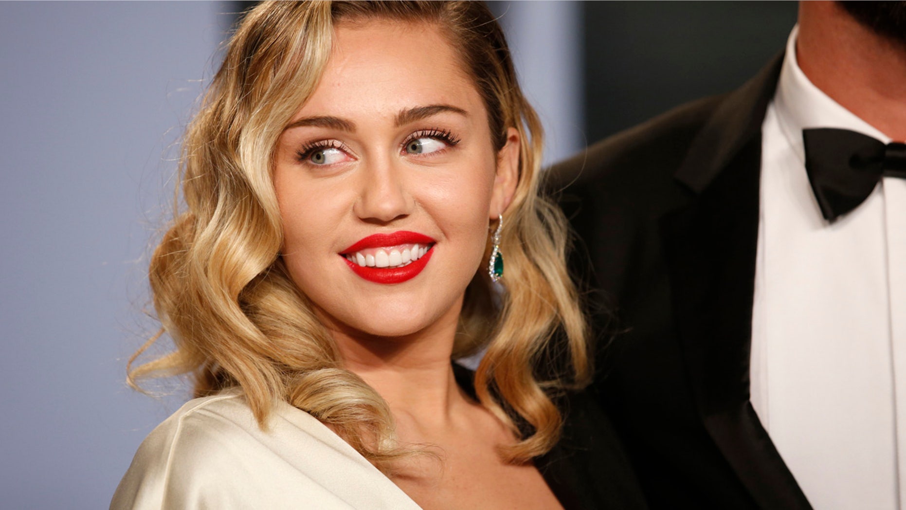 APRIL 2018: Miley Cyrus arrives at the 2018 Vanity Fair Oscar Party. She took to Twitter on Sunday to take back an apology over a 2008 Vanity Fair photo spread.