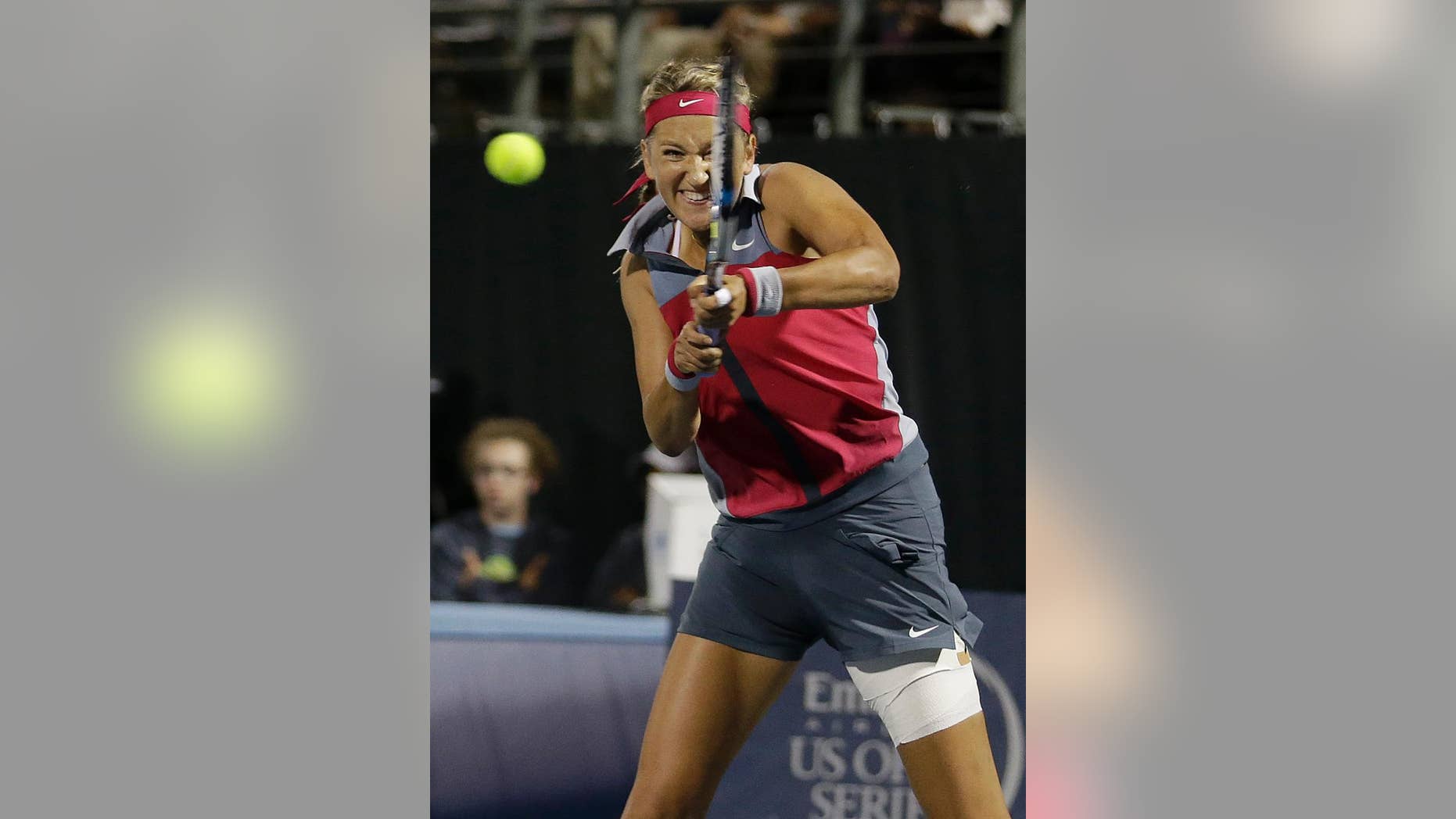 Victoria Azarenka, from Belarus, returns the ball to Venus Williams during the second set of their match in the Bank of the West Classic tennis tournament in Stanford, Calif., Thursday, July 31, 2014. Williams won 6-4, 7-6(1). (AP Photo/Jeff Chiu)