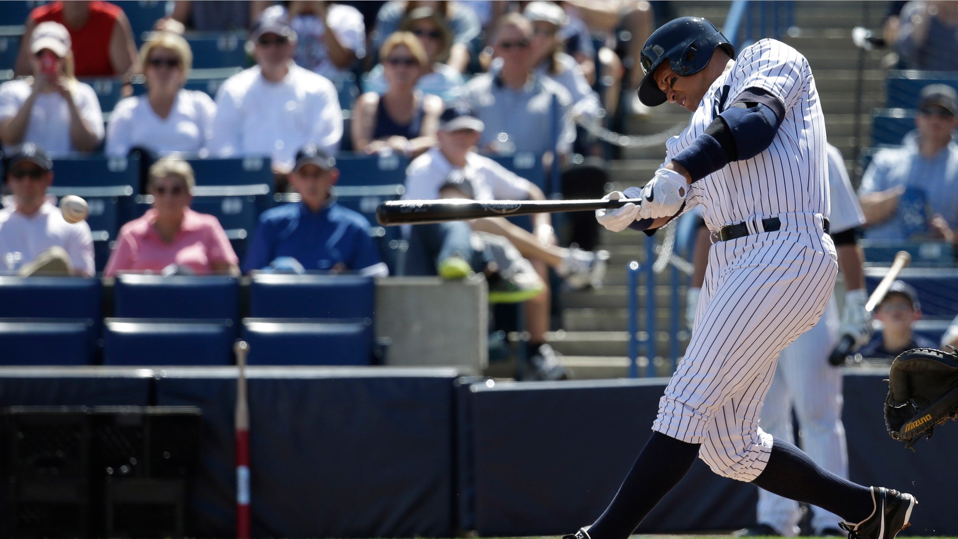 New York Yankees' designated hitter Alex Rodriguez hits a single in the first inning during a spring training baseball exhibition game against the Philadelphia Phillies, Wednesday, March 4, 2015, in Tampa, Fla. (AP Photo/Lynne Sladky)