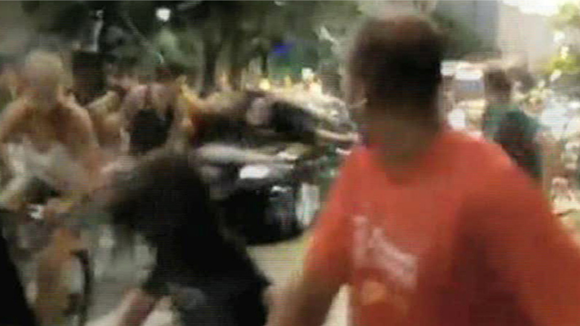 In this image taken from TV, showing the moment that a car drives into a group of cyclists in the city of Porto Alegre, Brazil, Friday Feb. 25, 2011.