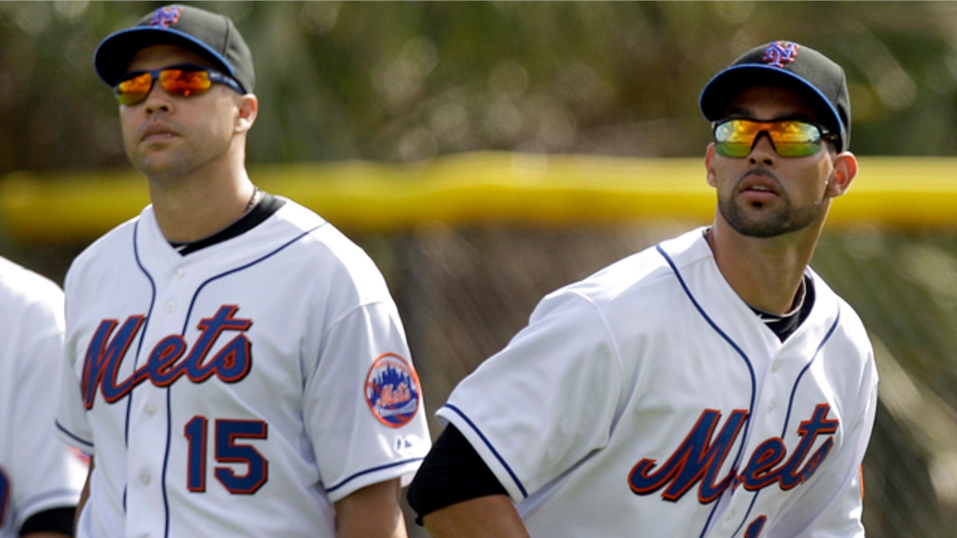 Feb. 21: New York Mets' Angel Pagan, right, tracks down a fly ball as fellow outfielder Carlos Beltran waits his turn at the drill during spring training baseball in Port St. Lucie, Fla.