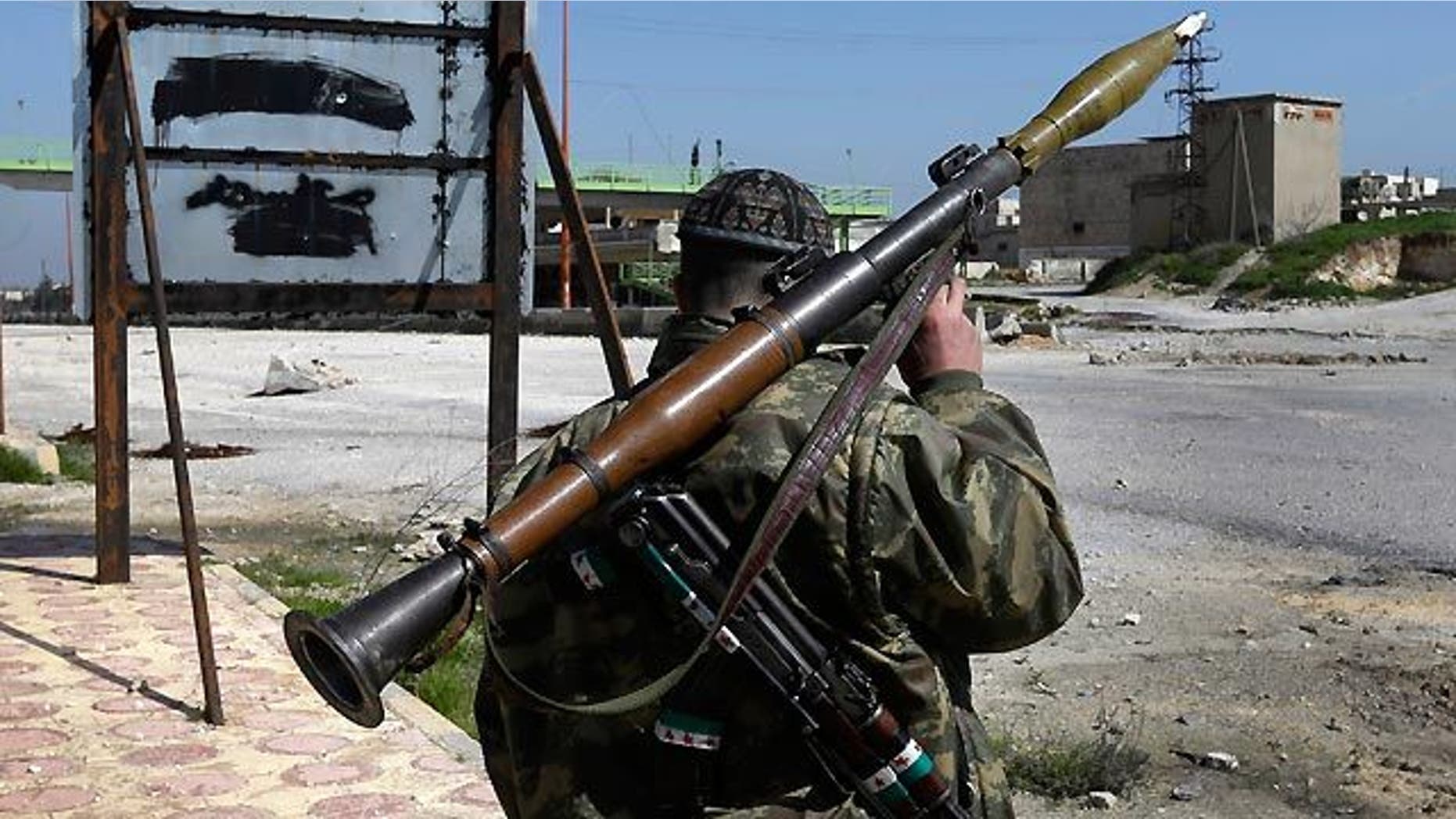 March 2, 2013: A Syrian fighter carries a shoulder-launched missile (AP/File)