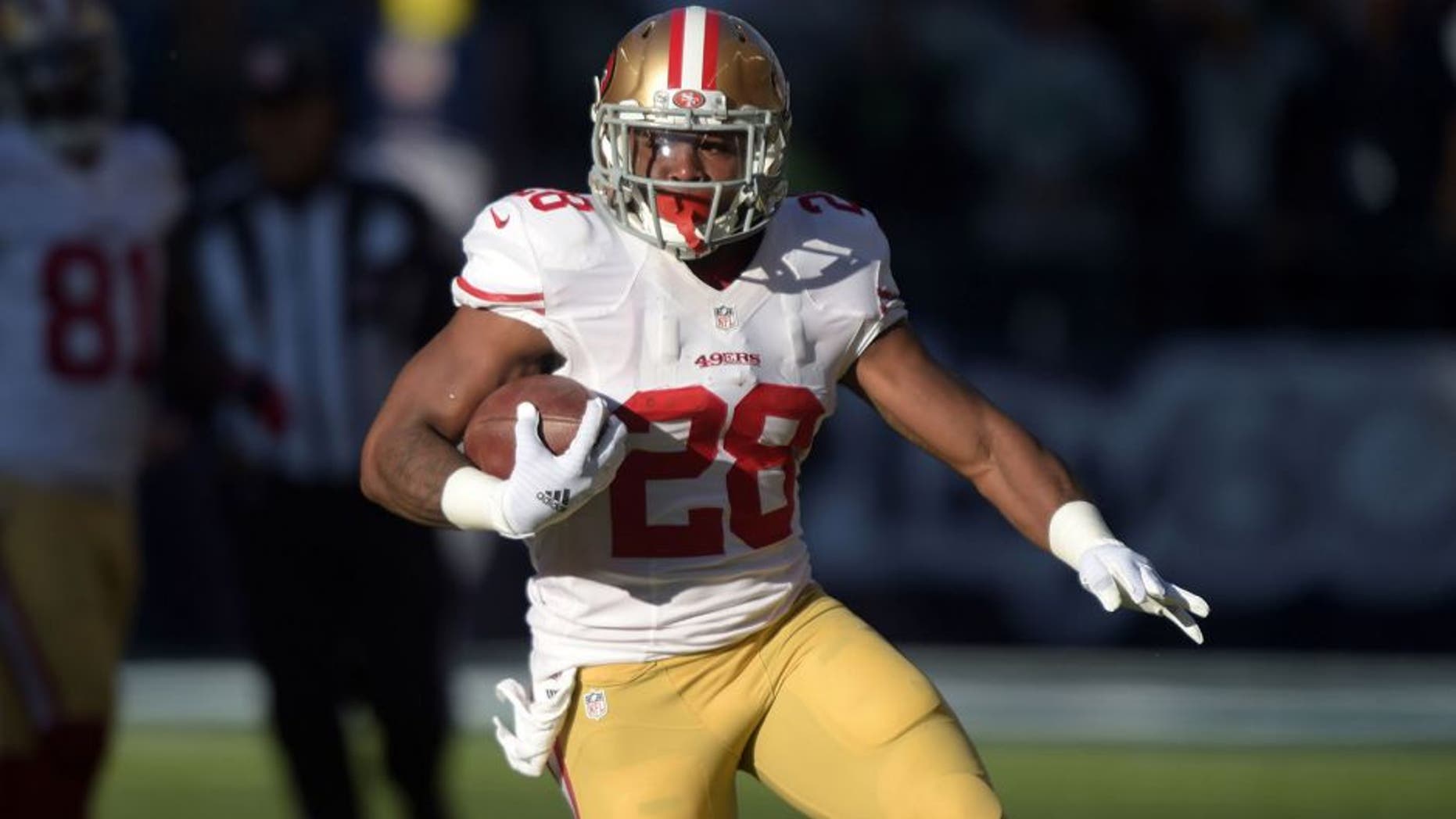 Dec 14, 2014; Seattle, WA, USA; San Francisco 49ers running back Carlos Hyde (28) carries the ball on a 289-yard run in the first quarter against the Seattle Seahawks at CenturyLink Field. Mandatory Credit: Kirby Lee-USA TODAY Sports