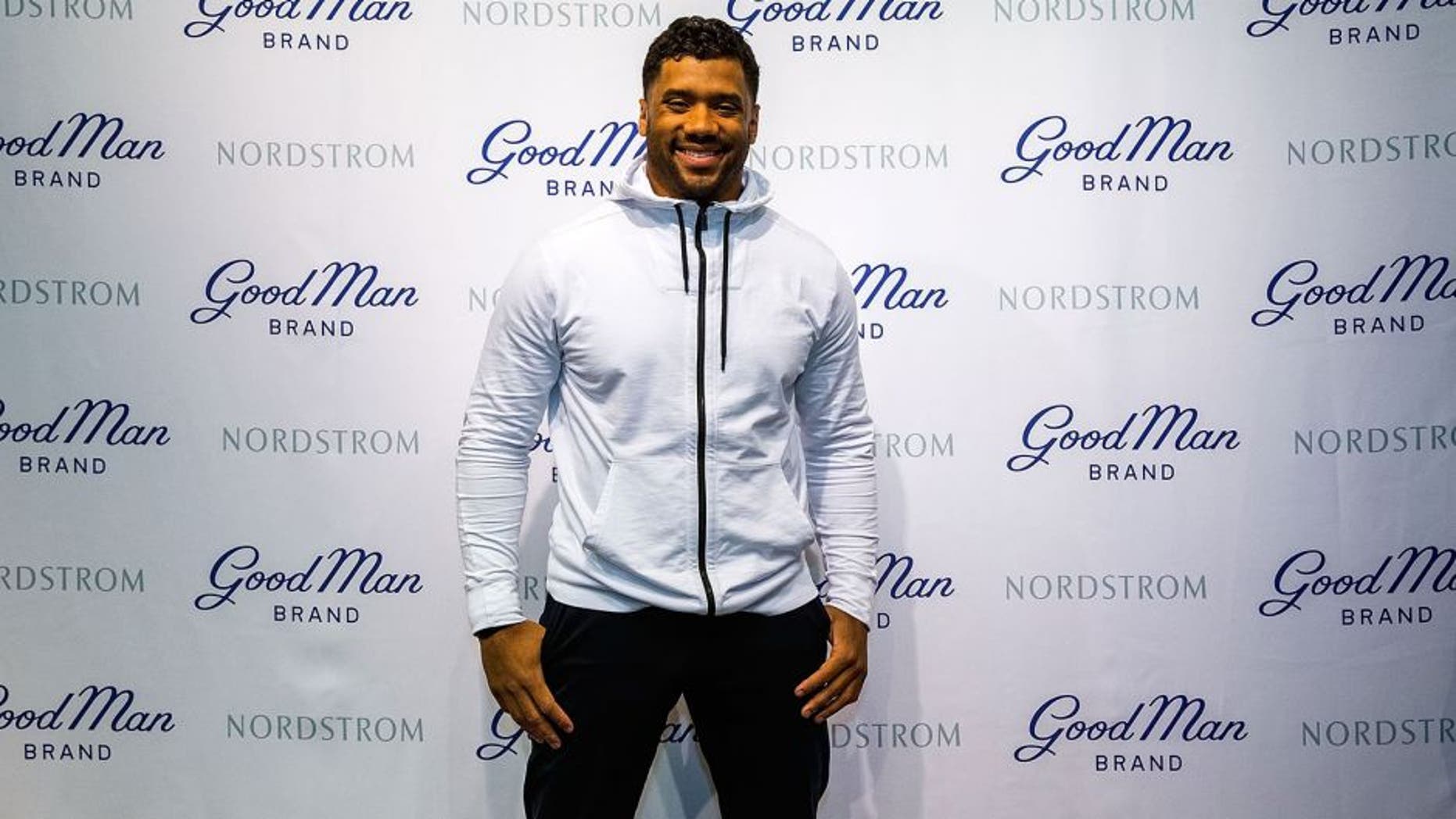 SEATTLE, WA - FEBRUARY 29: Seattle Seahawks quarterback Russell Wilson poses for a photo at Nordstrom on February 29, 2016 in Seattle, Washington. (Photo by Suzi Pratt/Getty Images for Nordstrom)