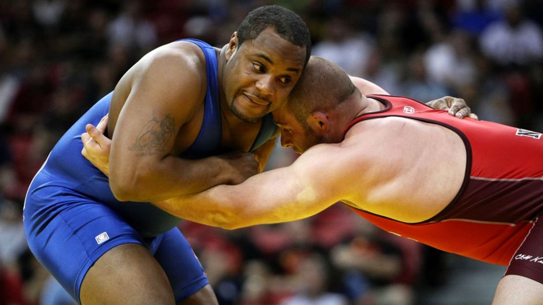 LAS VEGAS - JUNE 15: Daniel Cormier (blue) wrestles Damion Hahn (red) in the Freestyle 96kg division championship match during the USA Olympic trials for wrestling and judo on June 15, 2008 at the Thomas & Mack Center in Las Vegas, Neveda. (Photo by Jonathan Ferrey/Getty Images)