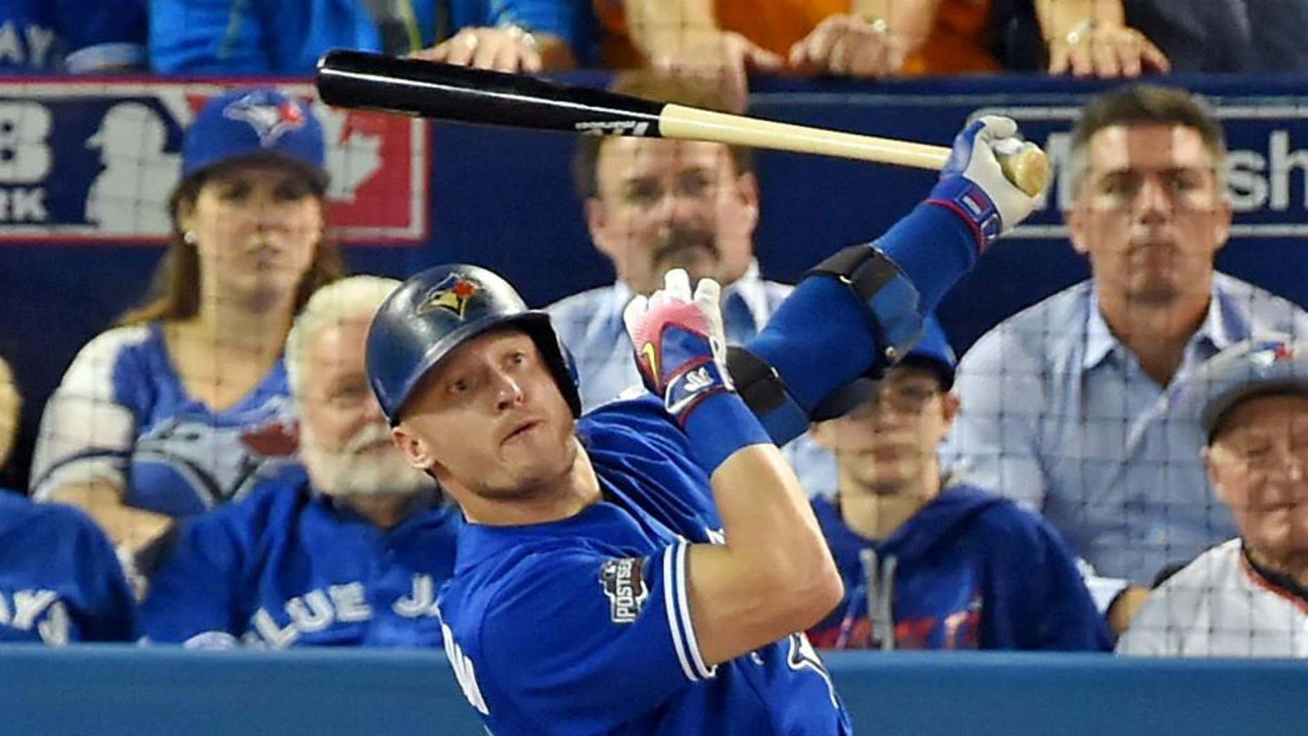 Oct 18, 2016; Toronto, Ontario, CAN; Toronto Blue Jays third baseman Josh Donaldson (20) hits a solo home run during the third inning against the Cleveland Indians in game four of the 2016 ALCS playoff baseball series at Rogers Centre. Mandatory Credit: Dan Hamilton-USA TODAY Sports