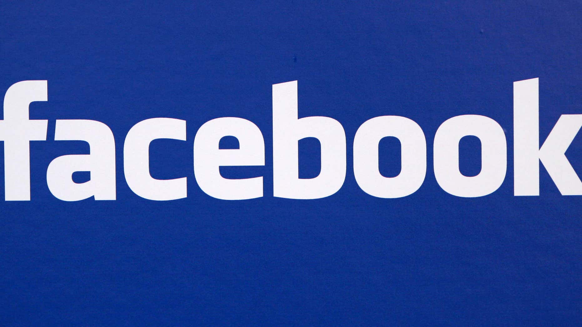 FILE - In this Nov. 6, 2007 file photo, the Facebook logo is displayed at a Facebook announcement in New York.